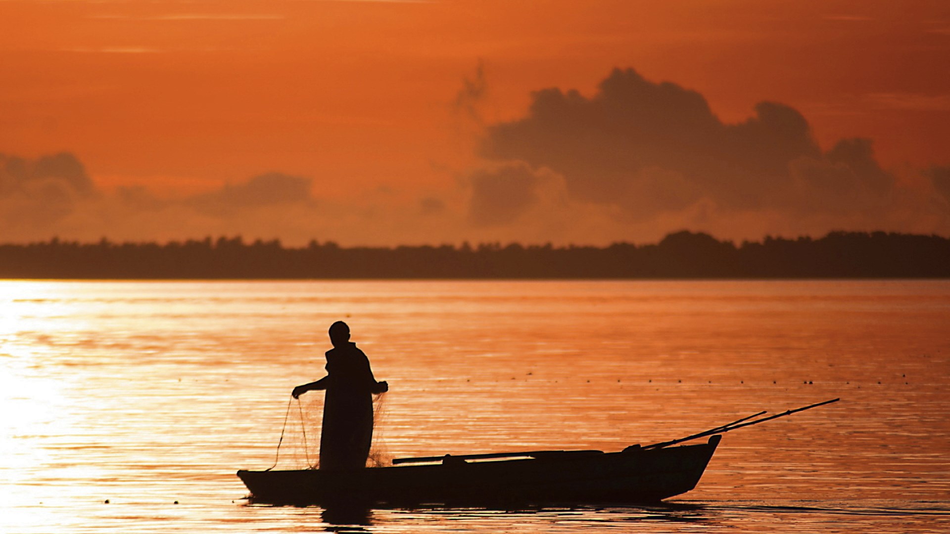 Fisherman in a boat at sunset HD Wallpaper