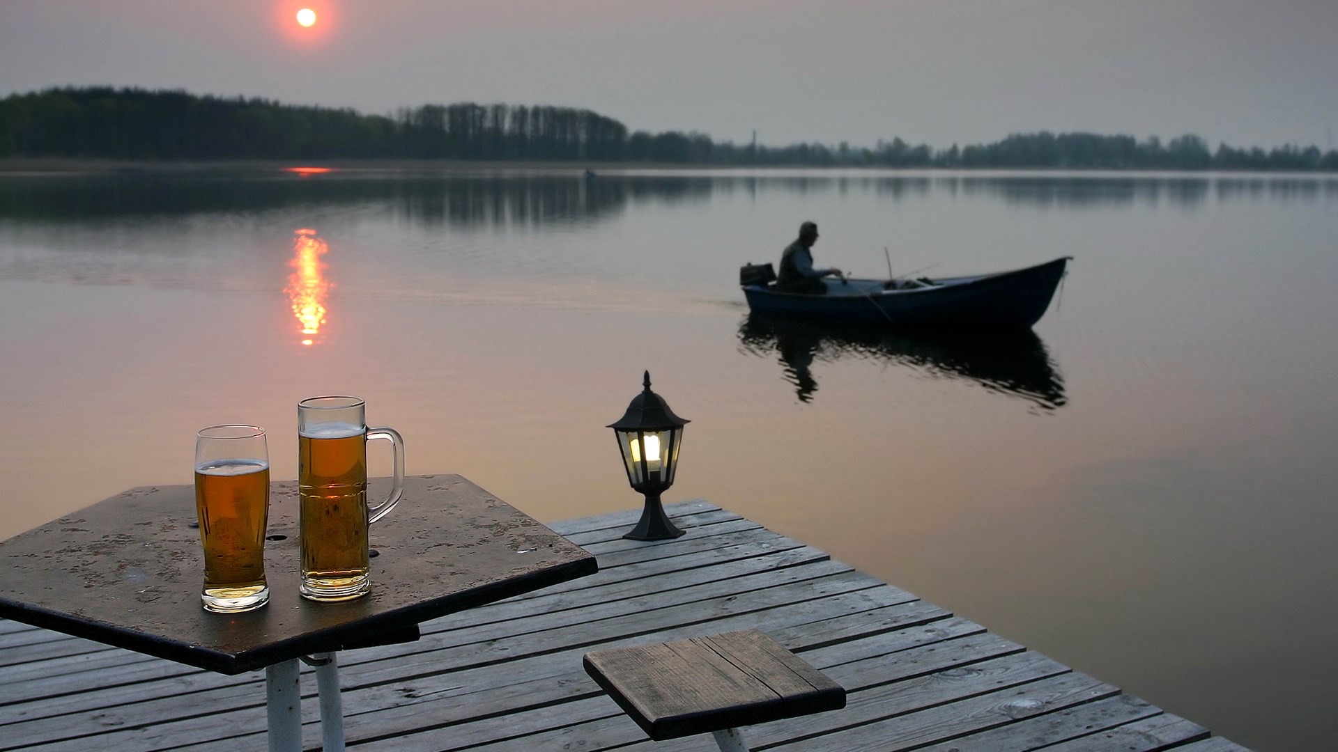 Two beers on a table by a lake at sunset HD Wallpaper