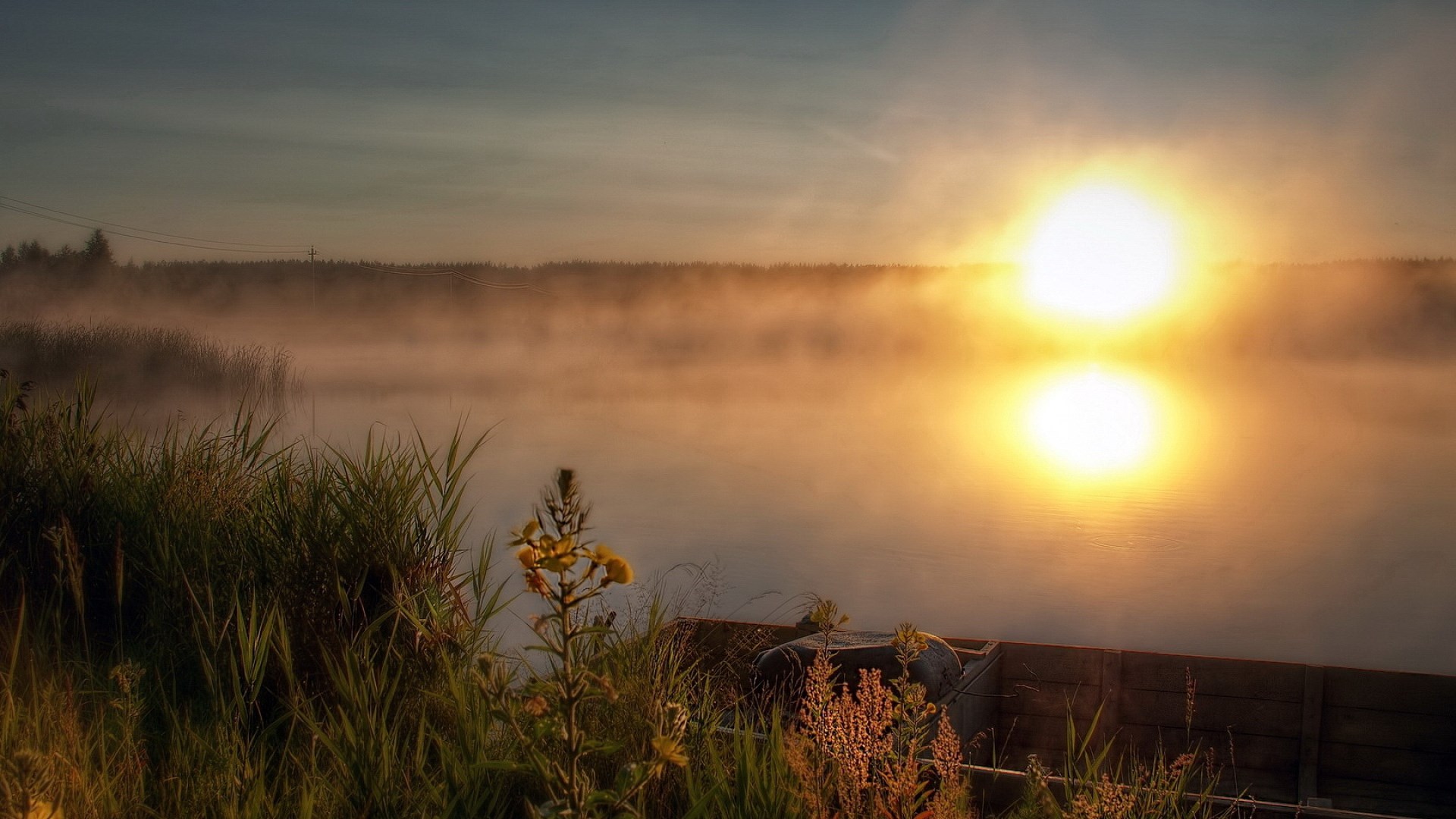 Sunrise over a misty lake with reeds and wooden dock HD Wallpaper