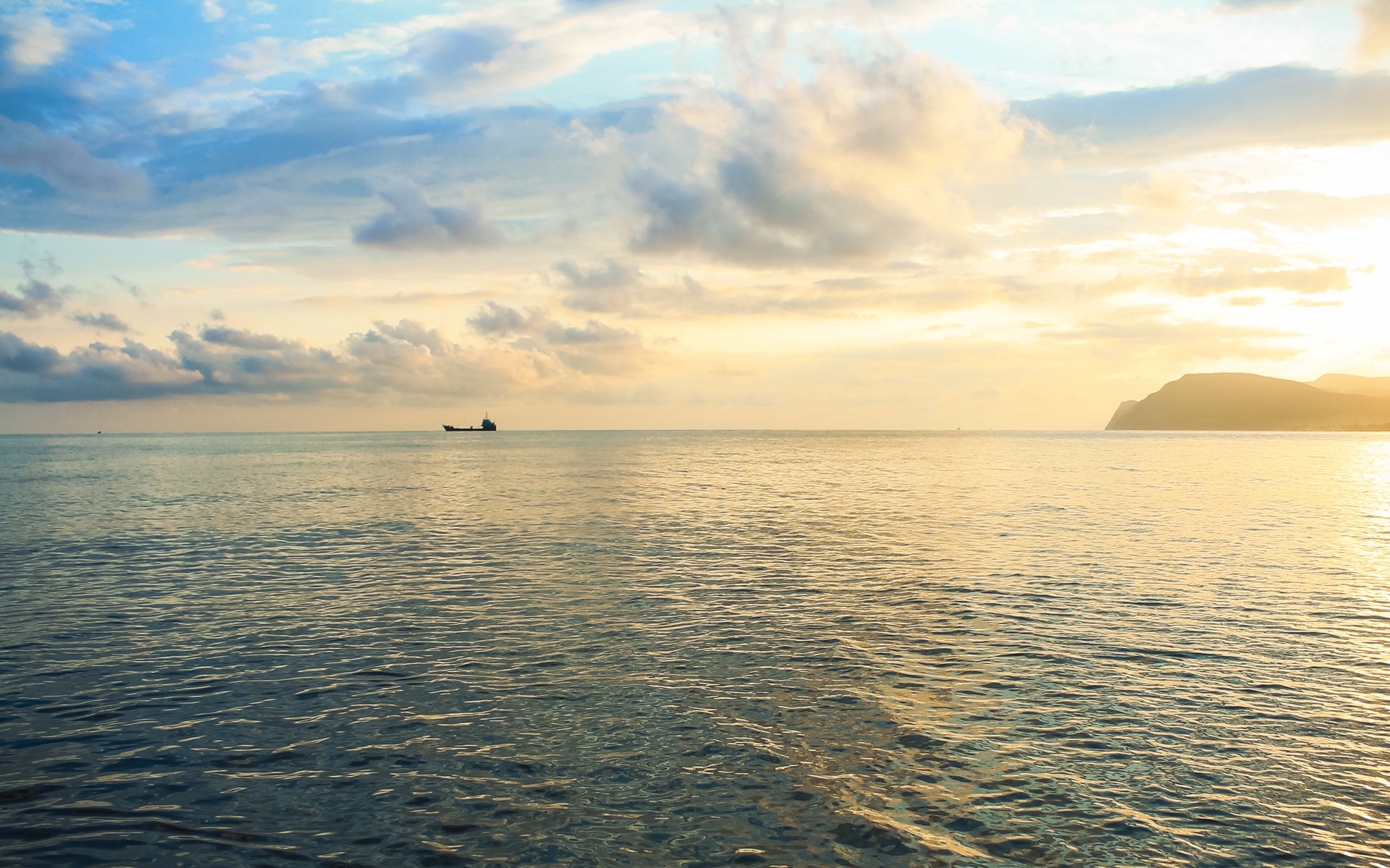 Ship on the sea at sunset with clouds and island HD Wallpaper