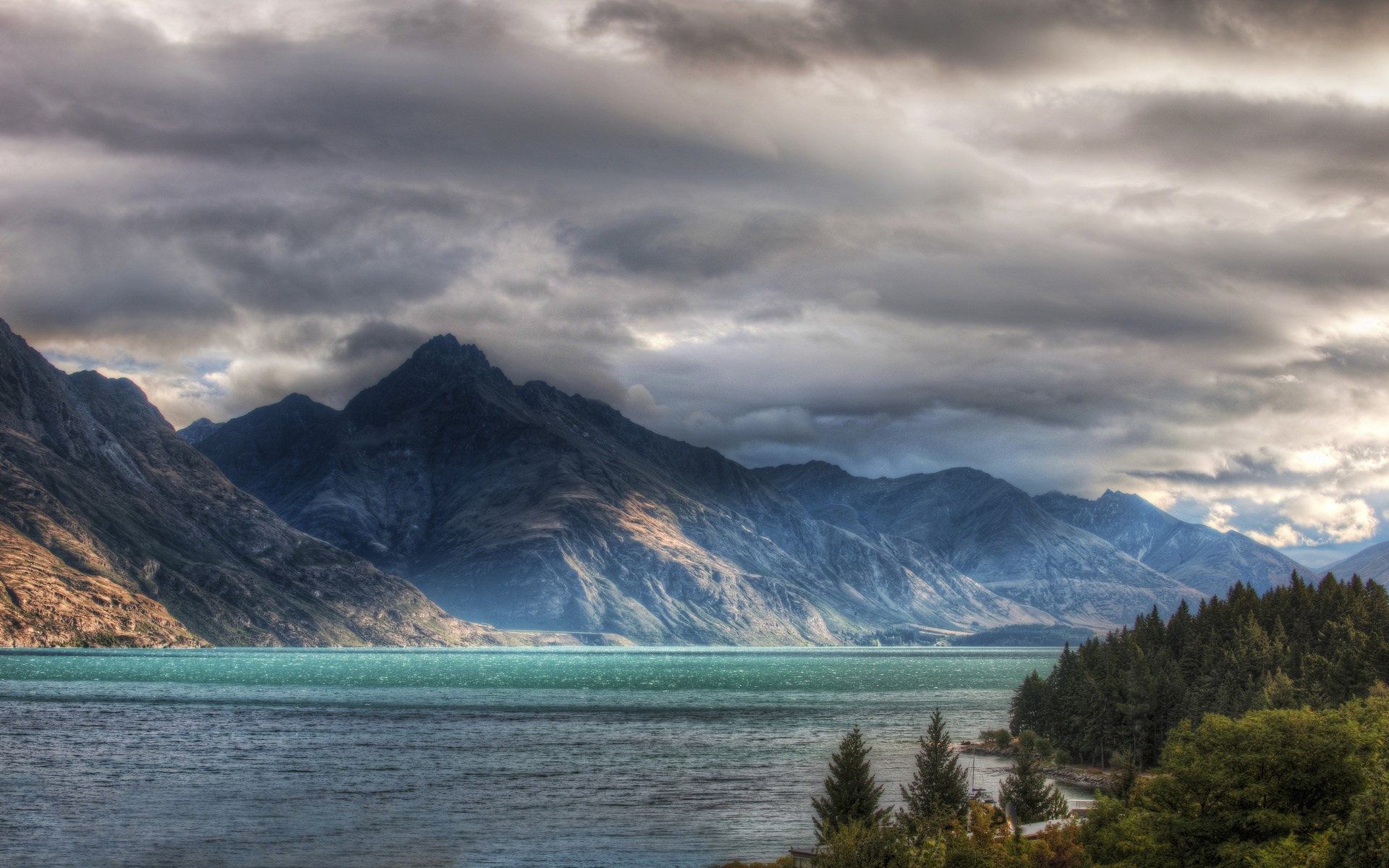 Mountains and lake under cloudy sky HD Wallpaper