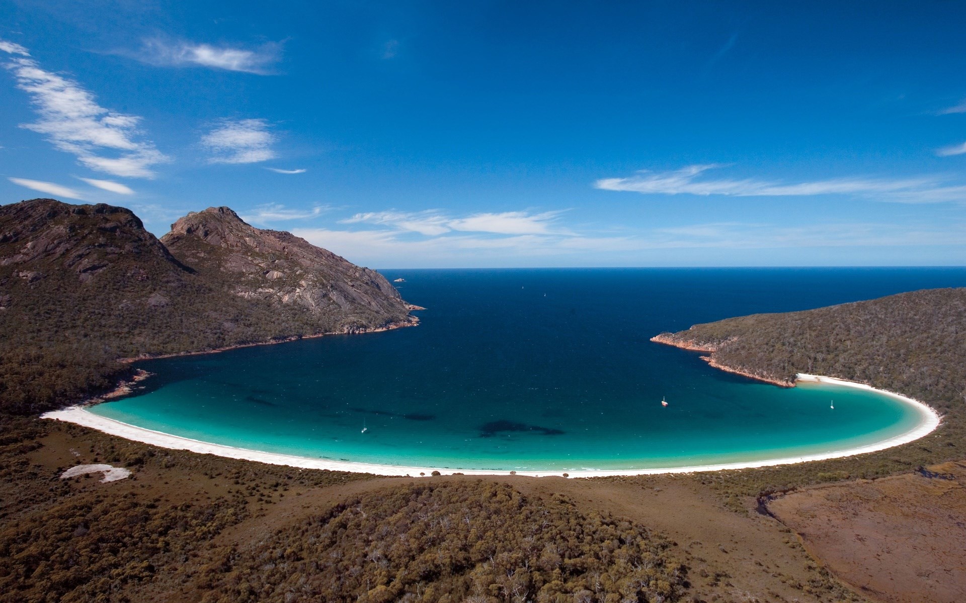 Bay with white sand beach and forested hills HD Wallpaper