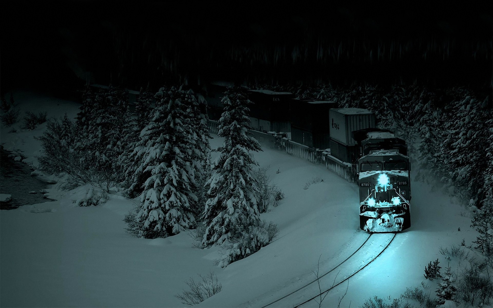 Train in a snowy forest at night HD Wallpaper