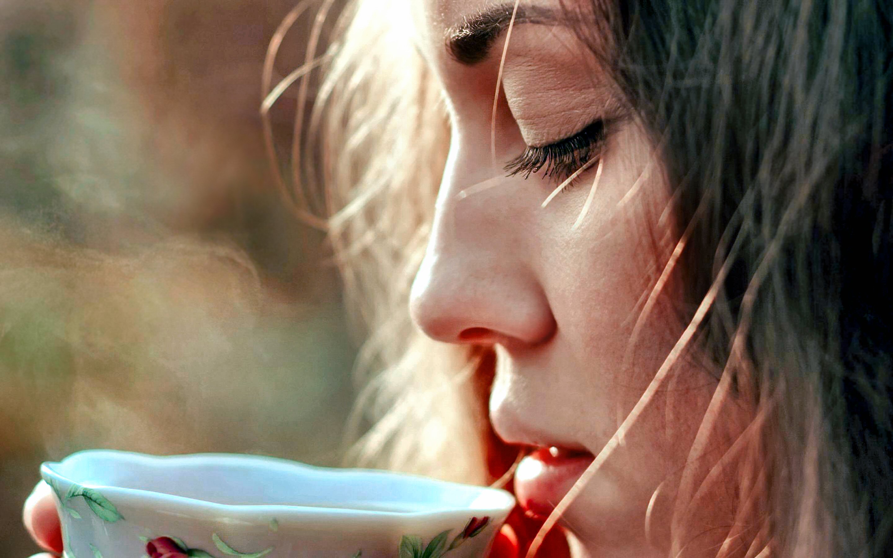 Woman drinking from a teacup HD Wallpaper
