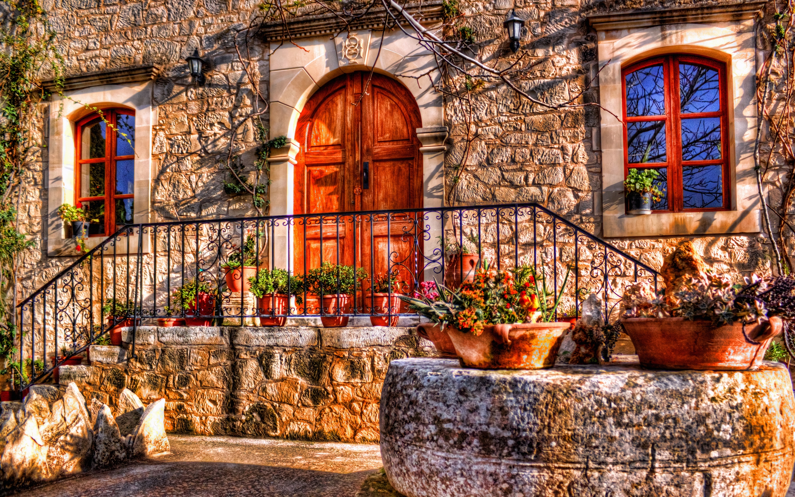 Stone house with wooden door and windows HD Wallpaper
