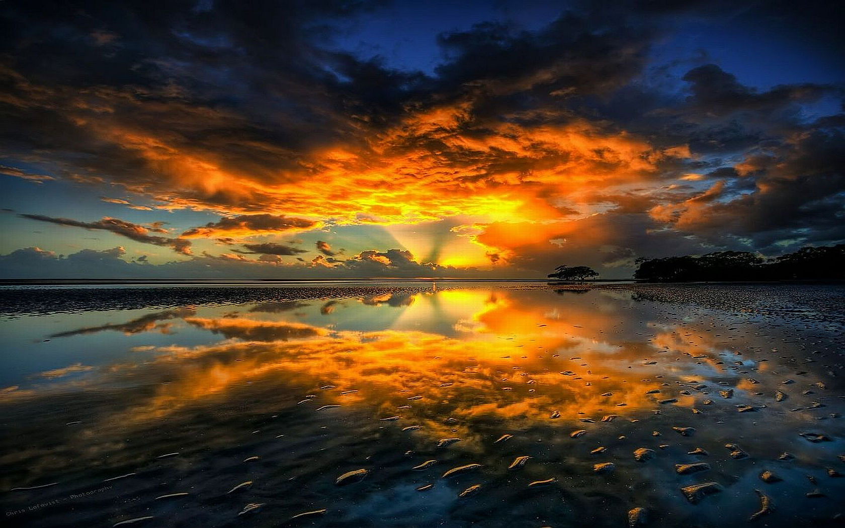 Sunset reflection on a beach with dramatic clouds HD Wallpaper