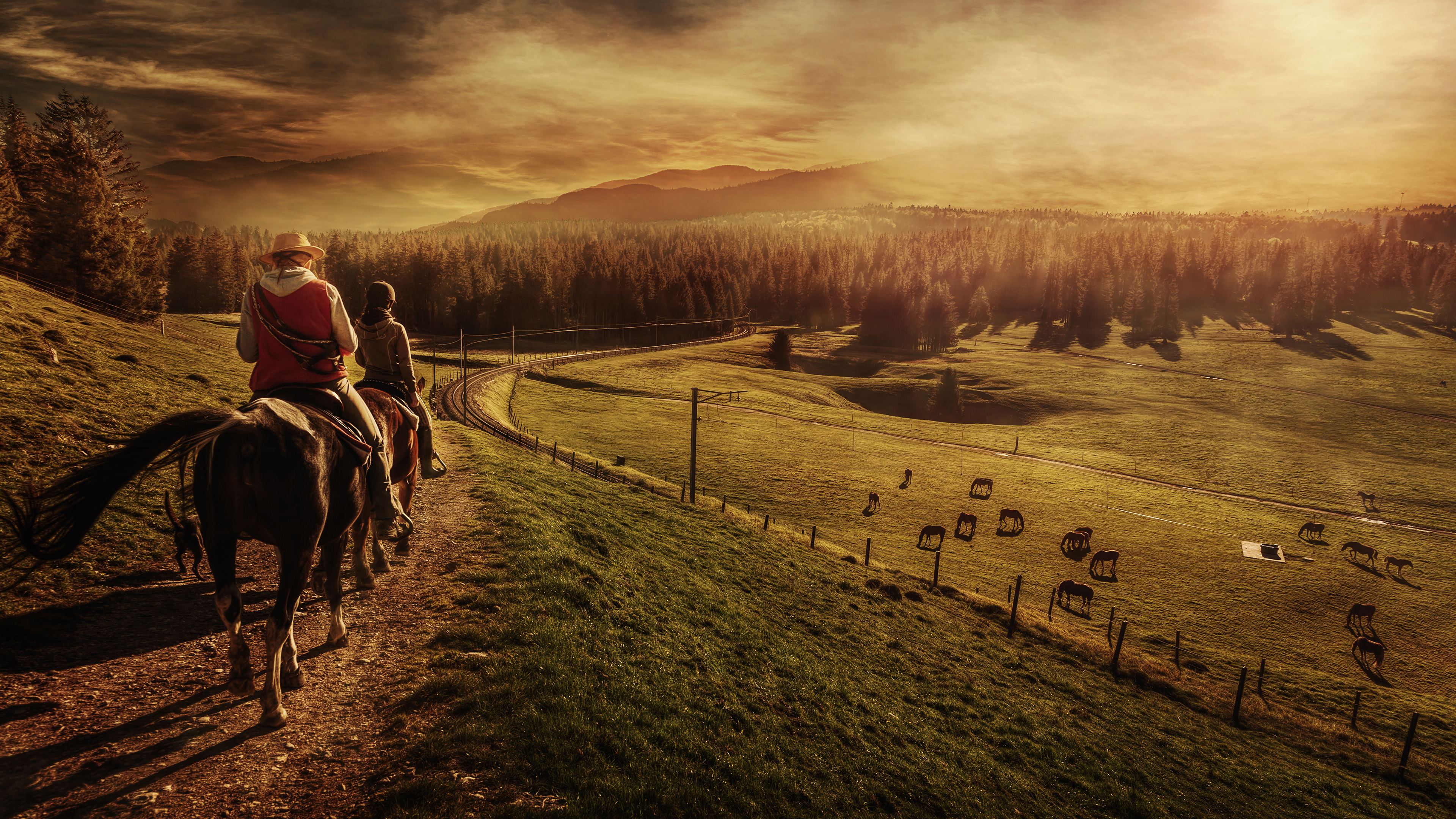 Two people on horseback in a landscape at sunset HD Wallpaper