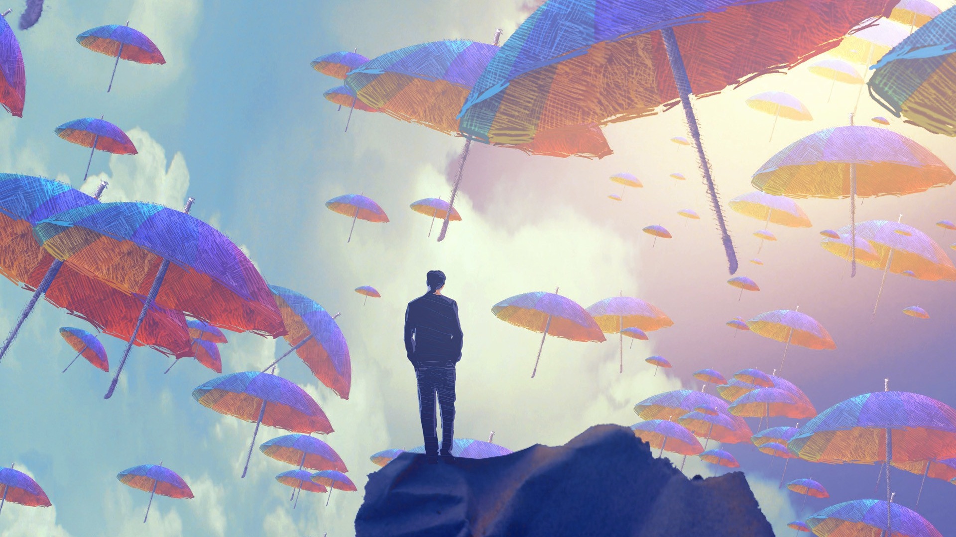 Man standing on rock with umbrellas in the sky HD Wallpaper