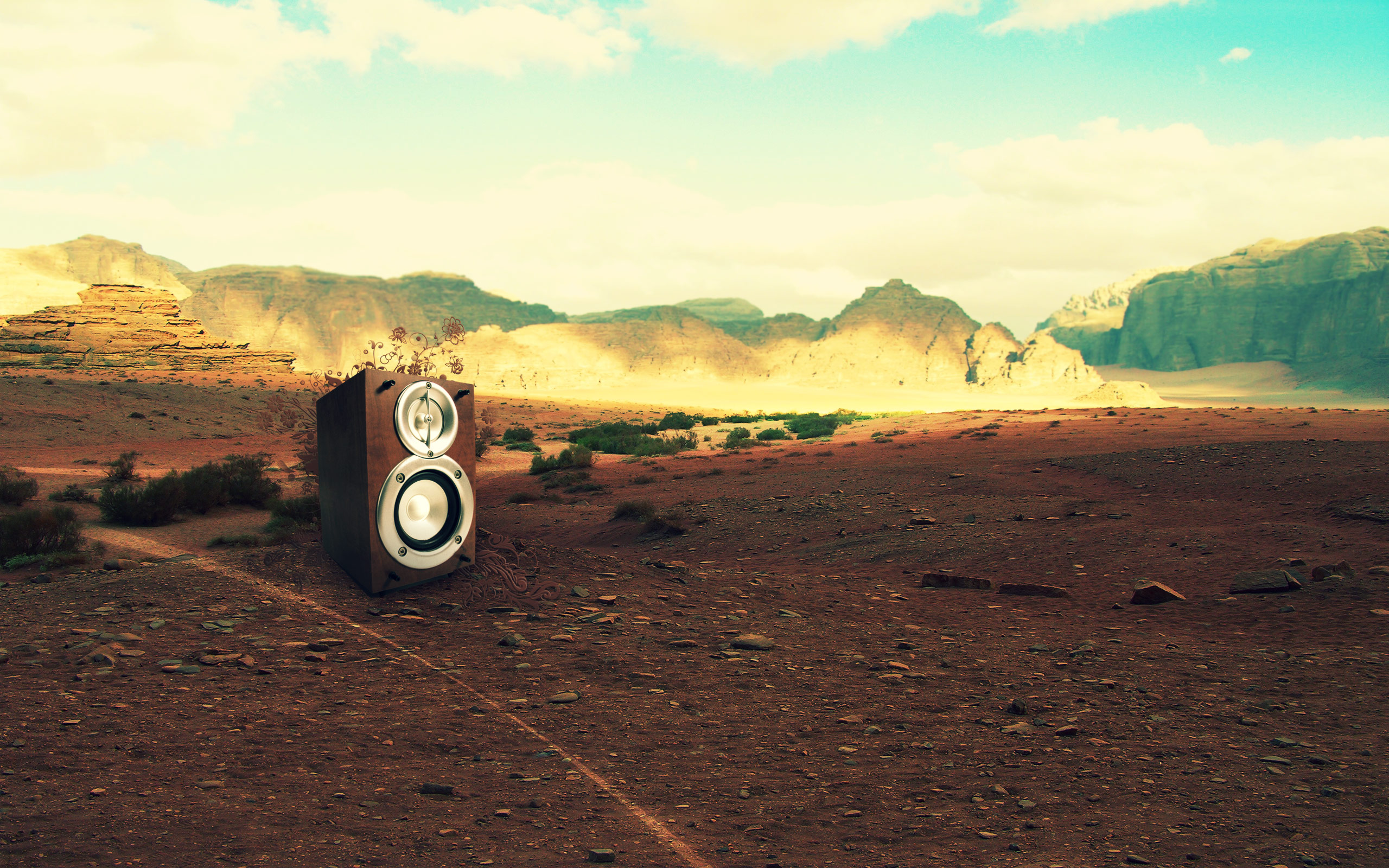 Speaker in a desert landscape with mountains HD Wallpaper
