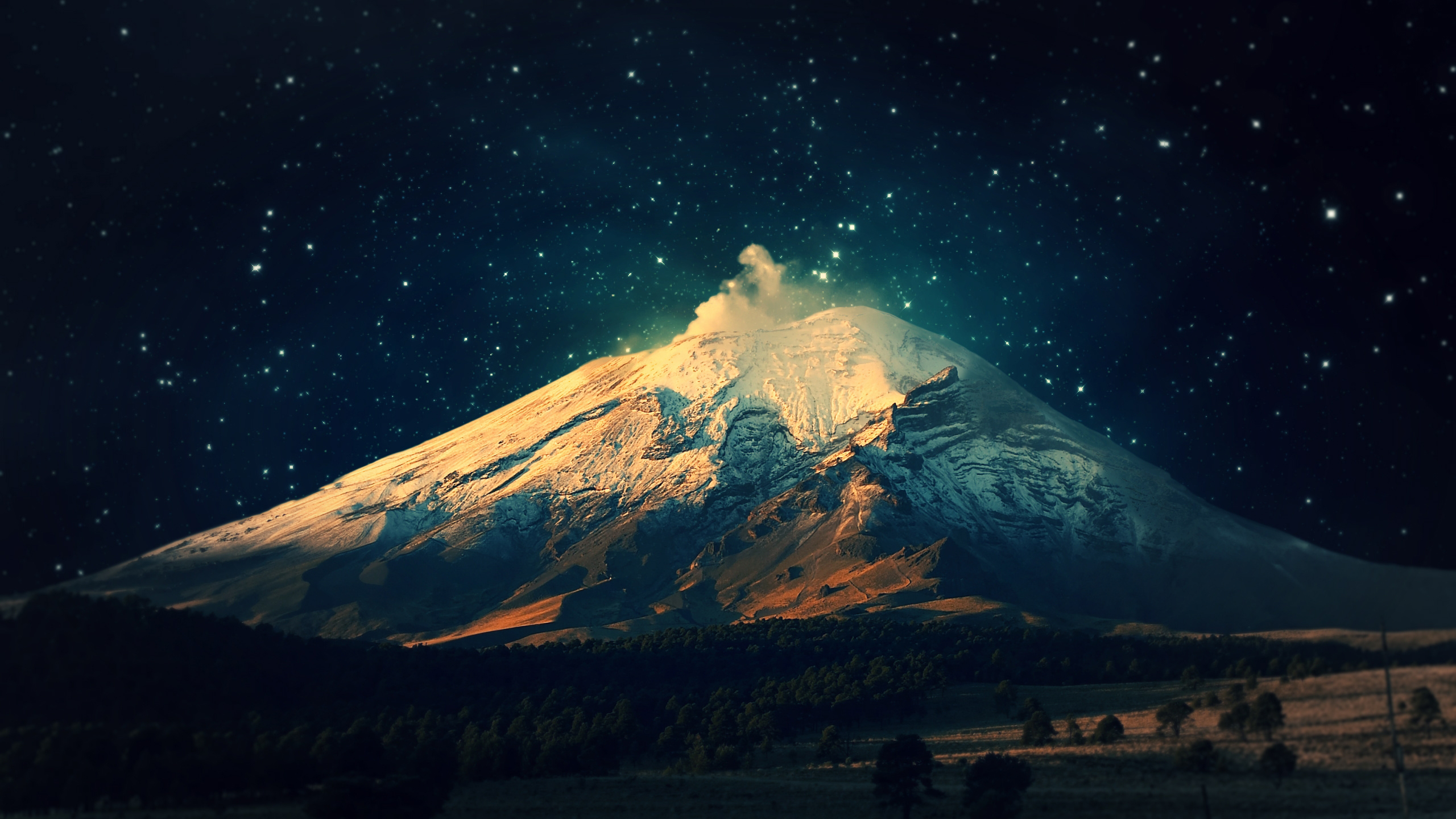 Volcano under a starry night sky HD Wallpaper