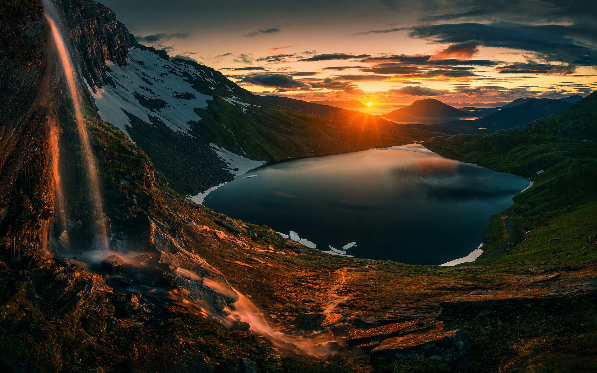Sunset over a mountain lake with a waterfall HD Wallpaper