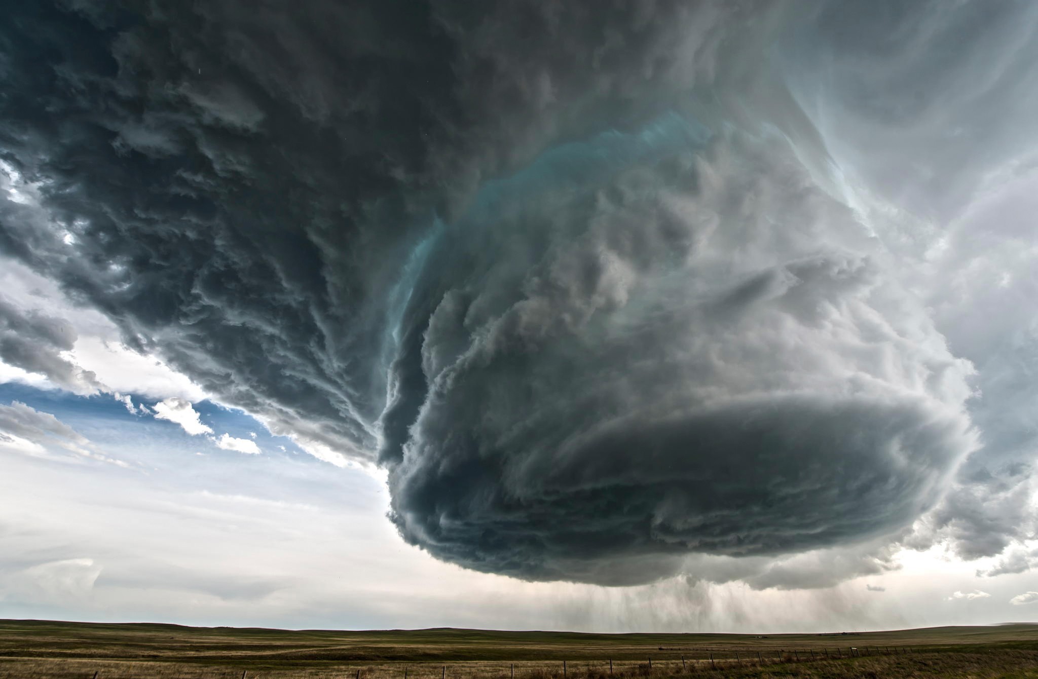 Massive storm cloud over a field HD Wallpaper