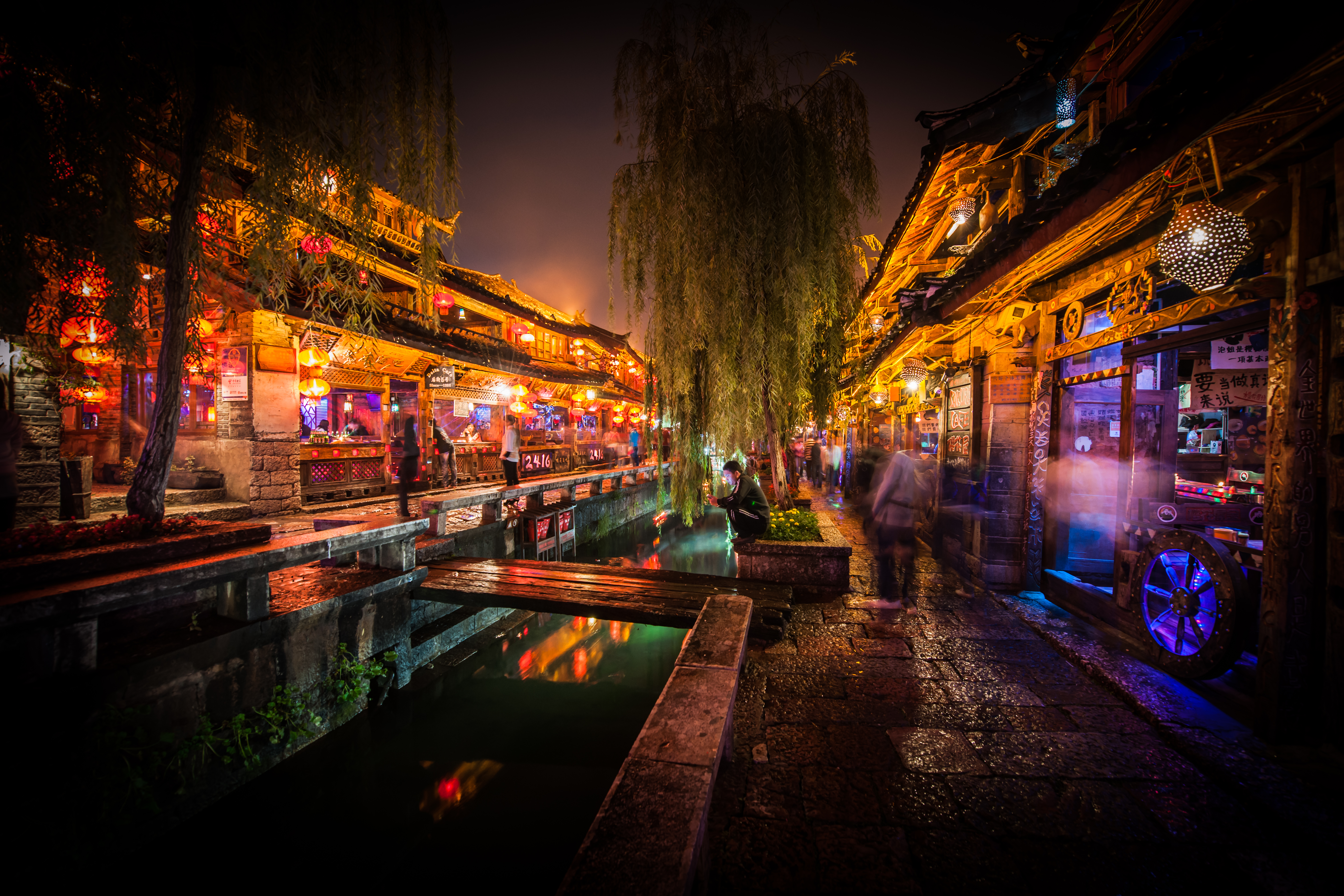 Night scene in Lijiang, China with shops and a canal HD Wallpaper