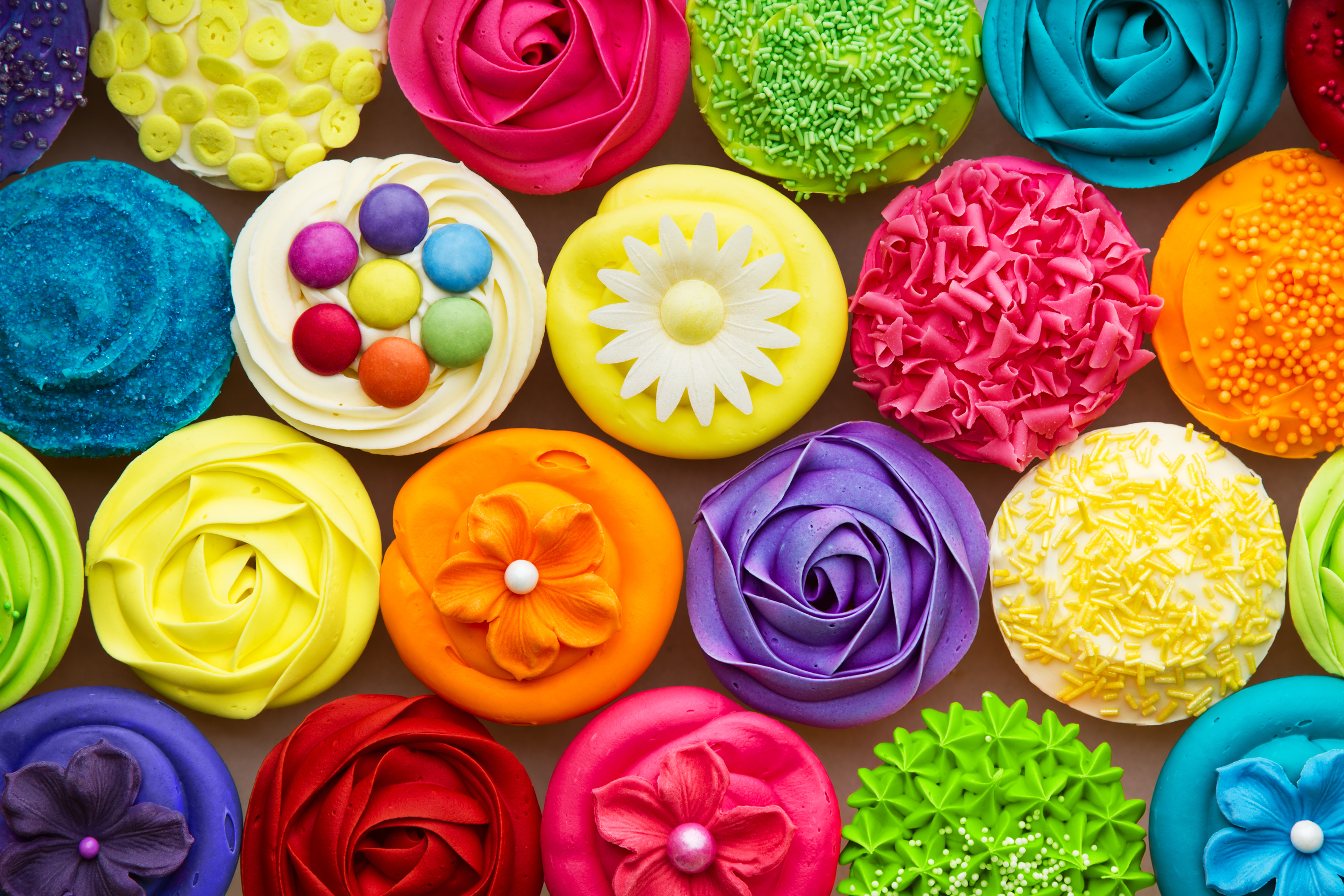 Assortment of colorful cupcakes HD Wallpaper