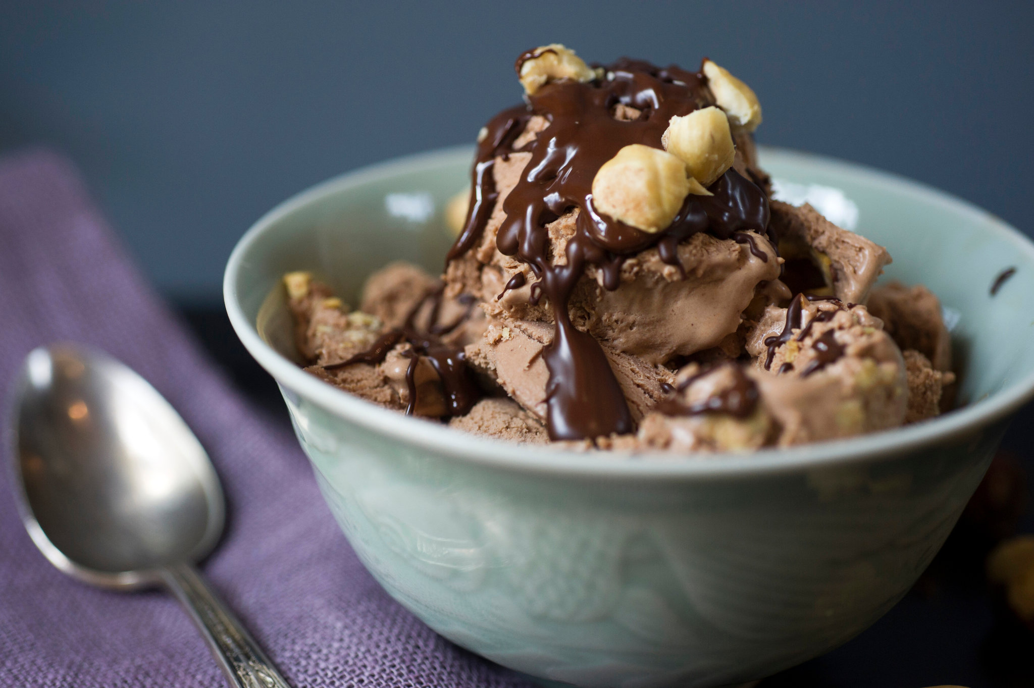Chocolate ice cream with chocolate syrup and hazelnuts HD Wallpaper