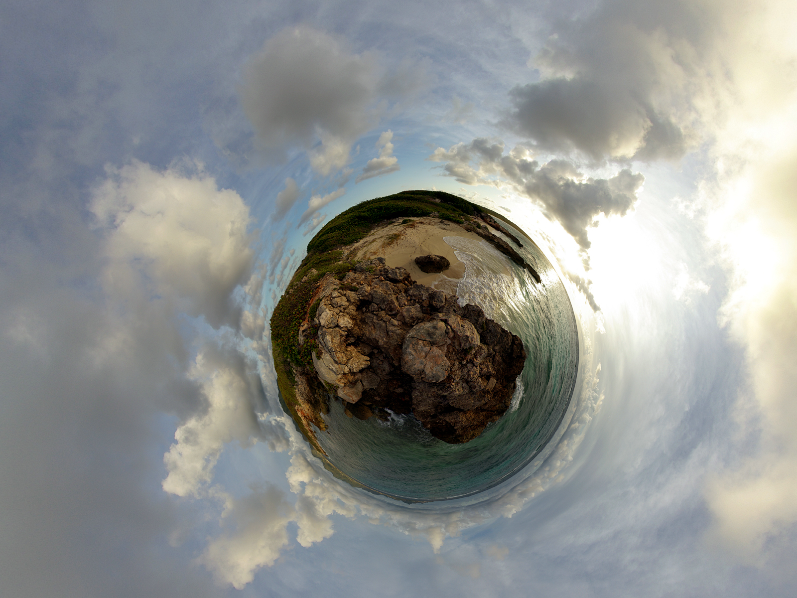 Planet view of rocky coastline and ocean under cloudy sky HD Wallpaper