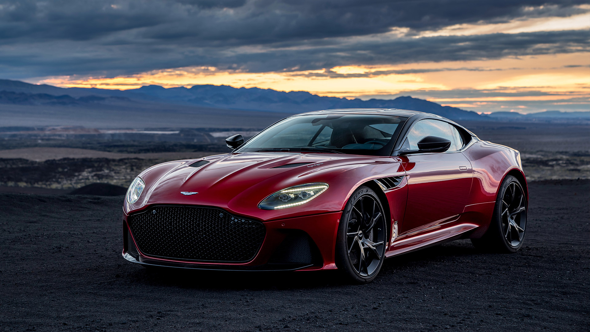 Red Aston Martin DBS Superleggera parked outdoors HD Wallpaper