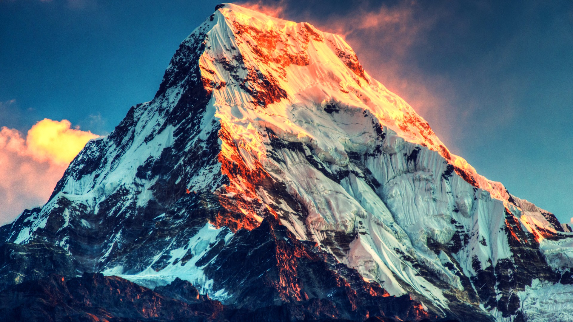 Snow-capped mountain peak at sunrise HD Wallpaper