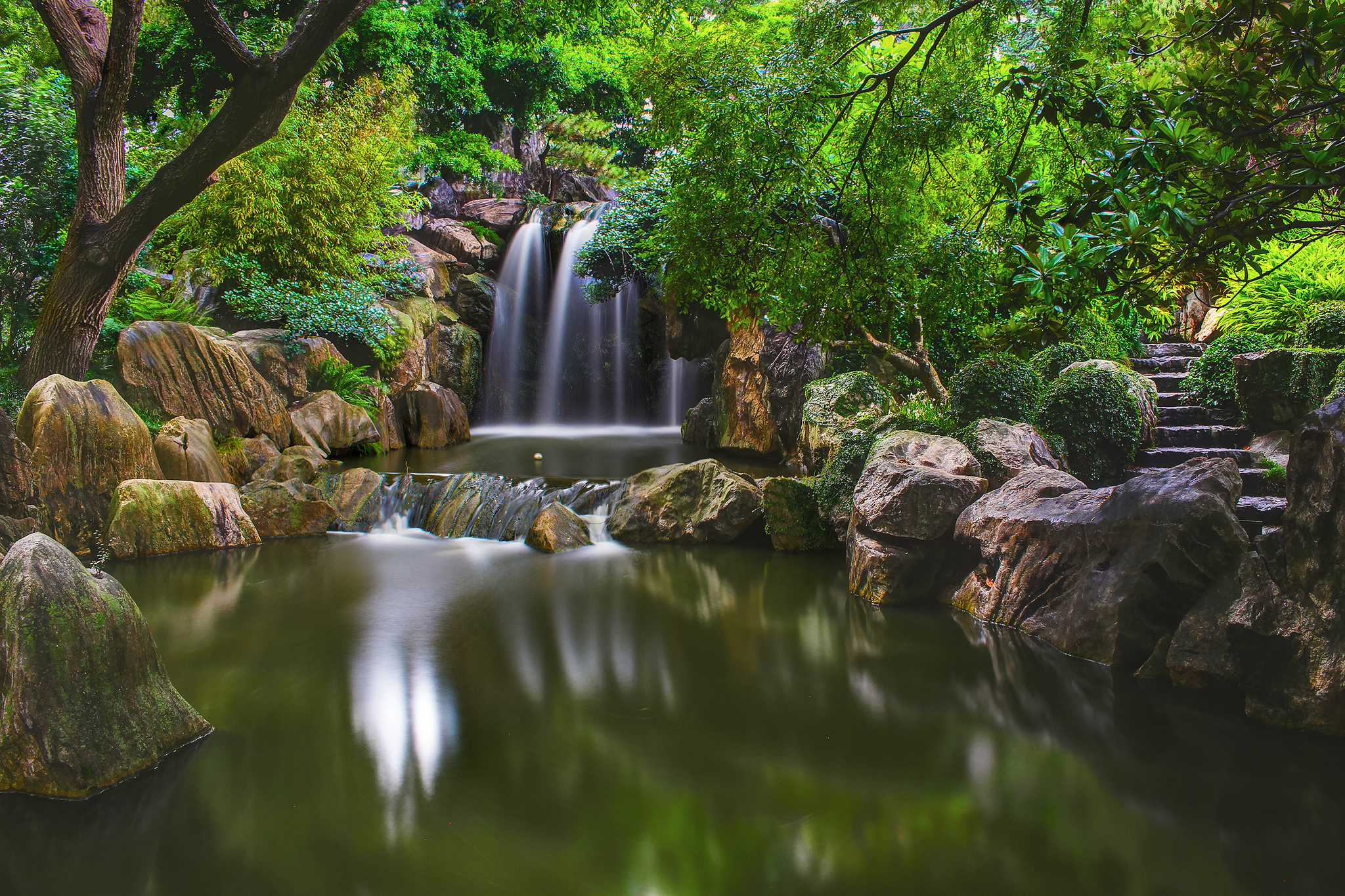 Waterfall in a rocky forest park with stone stairs HD Wallpaper