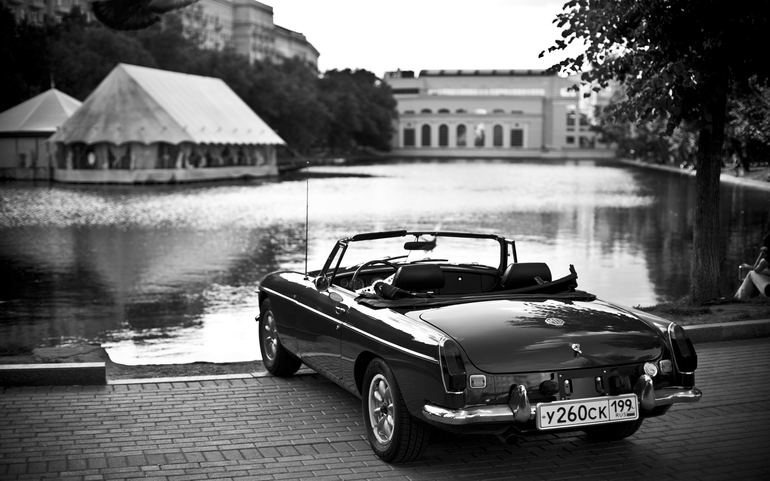 Black MG convertible parked by a lake HD Wallpaper
