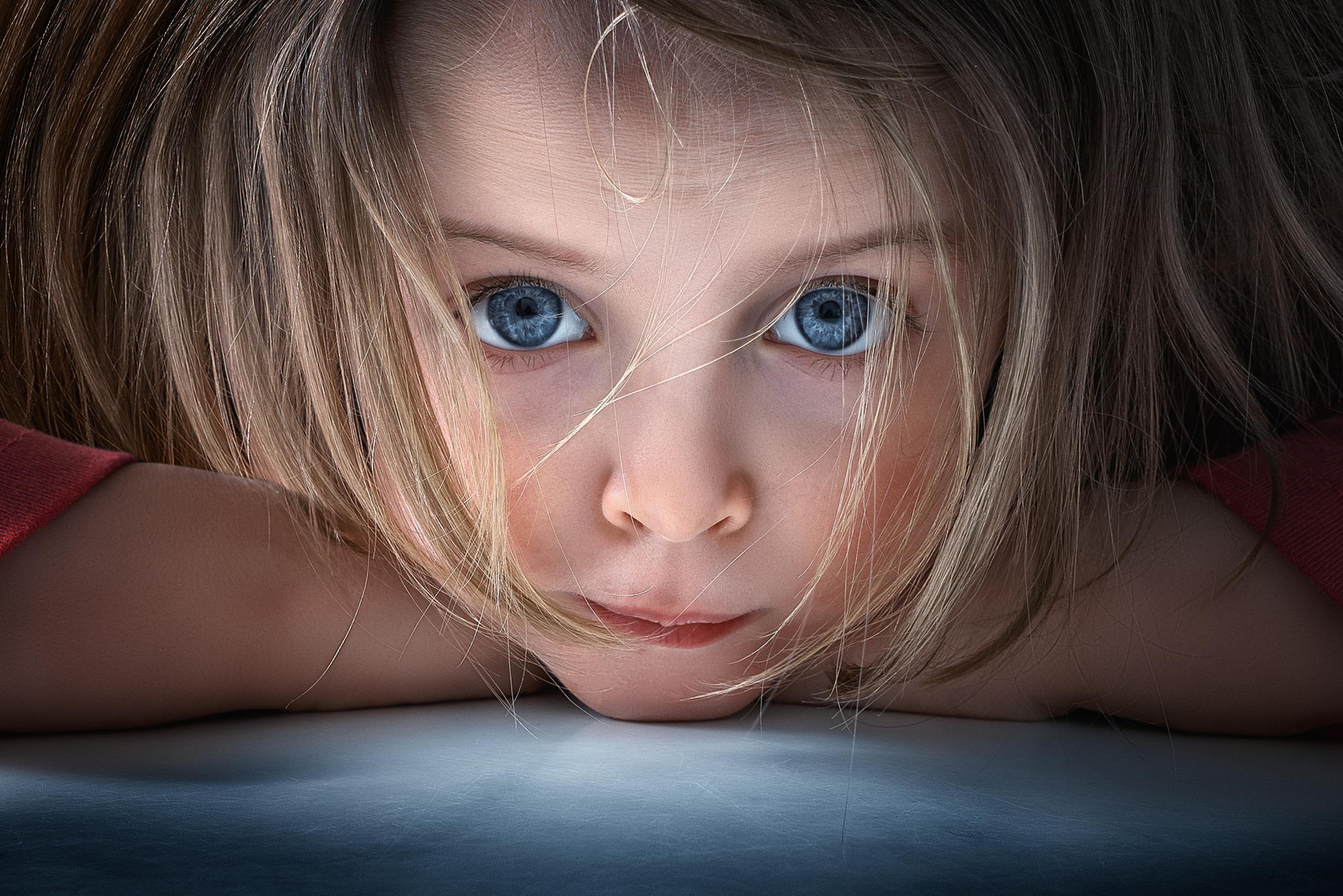 Close-up of a young girl with blonde hair and blue eyes HD Wallpaper