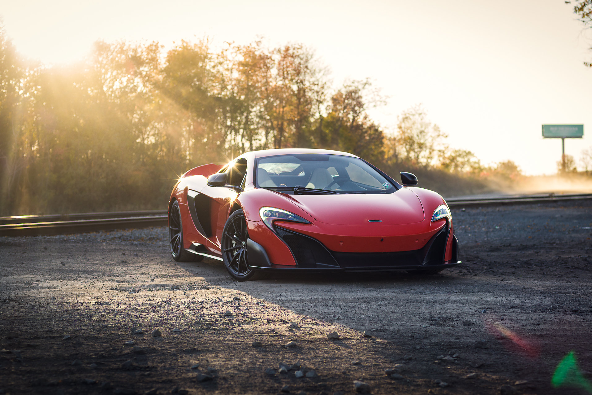Red McLaren 675LT Supercar on Train Tracks HD Wallpaper