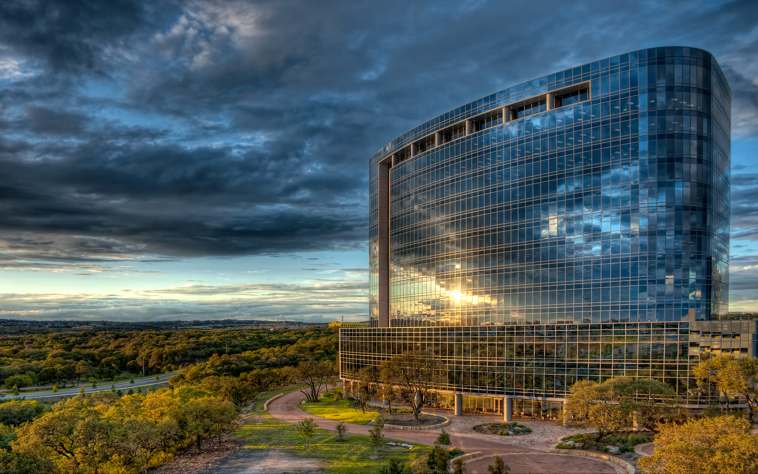 Modern glass office building at sunset HD Wallpaper