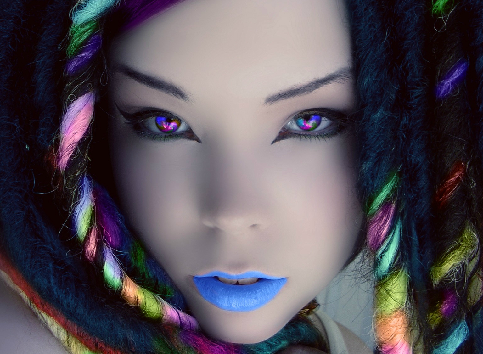 Woman with rainbow dreadlocks and colorful eyes HD Wallpaper