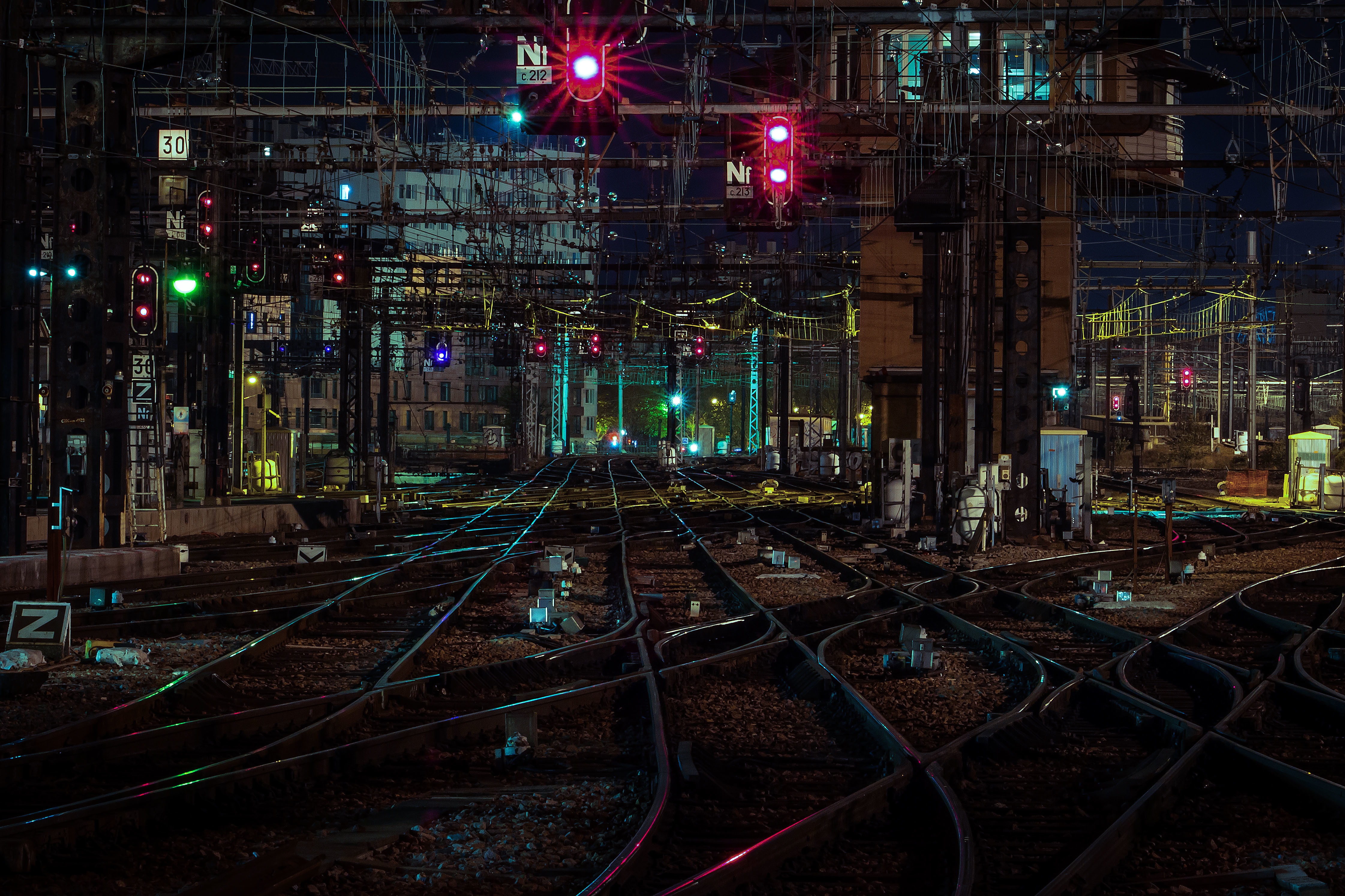 Train tracks and signals at night HD Wallpaper