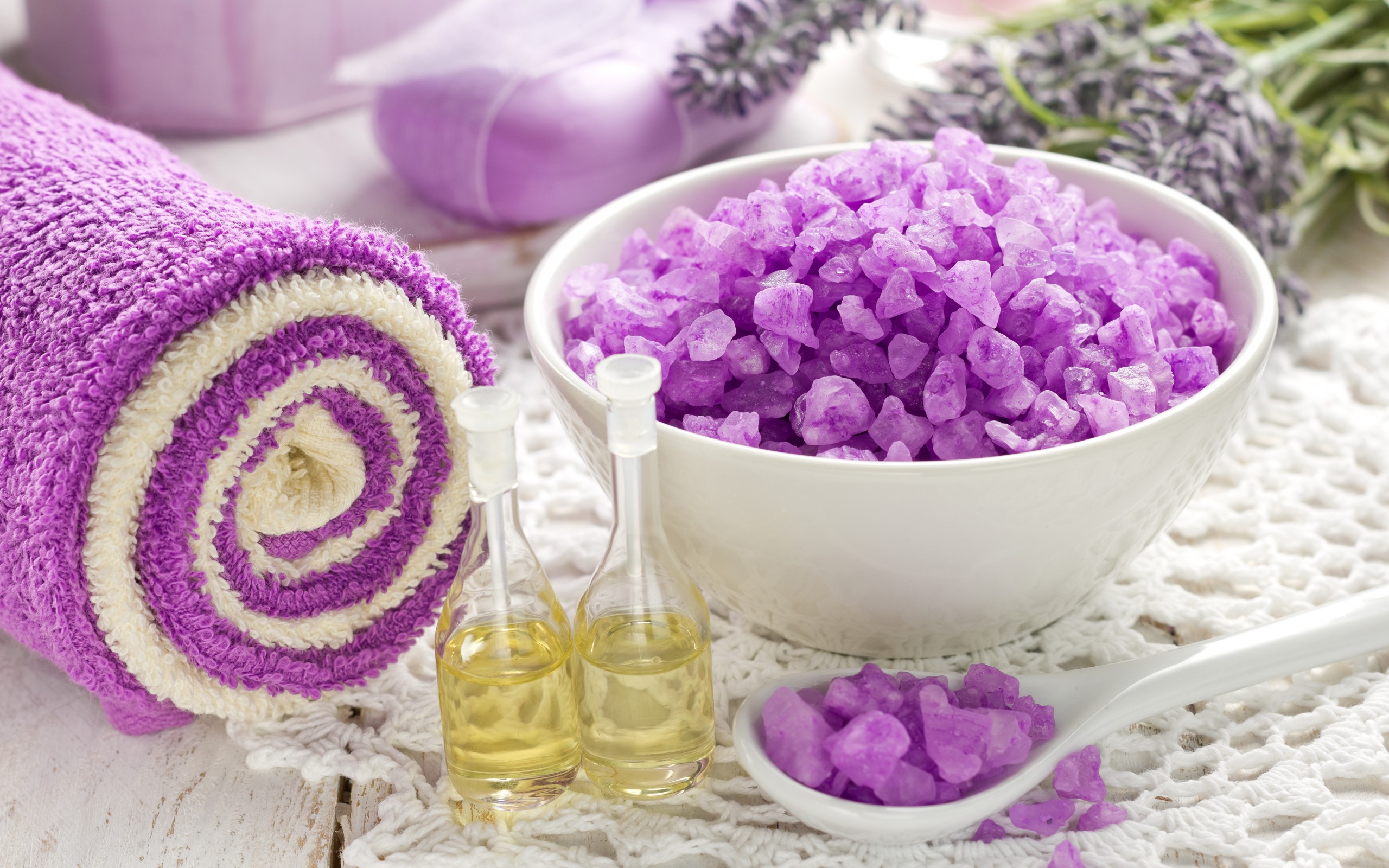 Spa items: rolled towel, bath salts, and essential oils HD Wallpaper