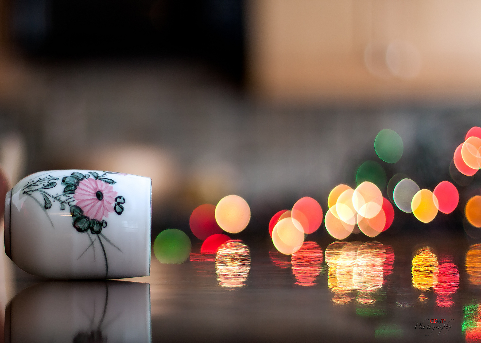 White teacup with pink flower design and bokeh lights HD Wallpaper