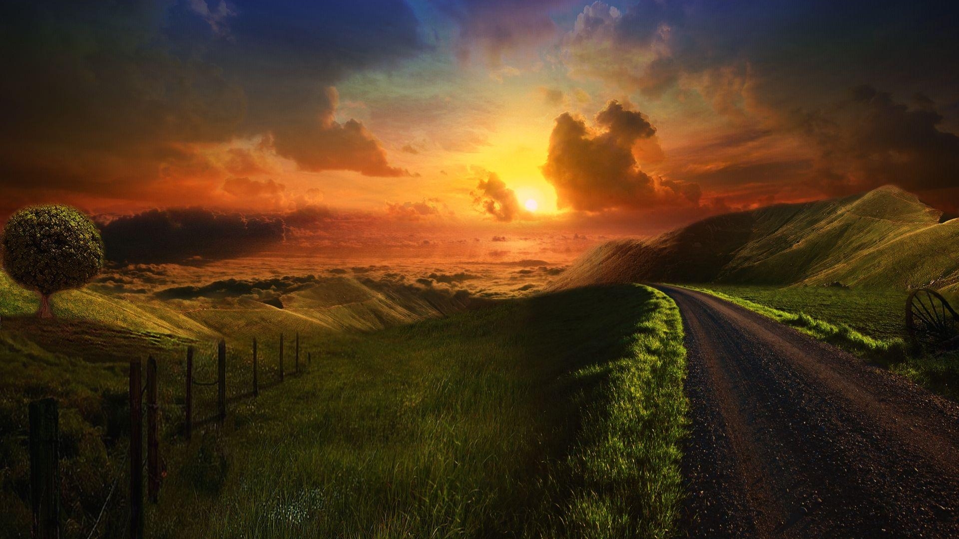 Sunset over rolling hills with a dirt road HD Wallpaper