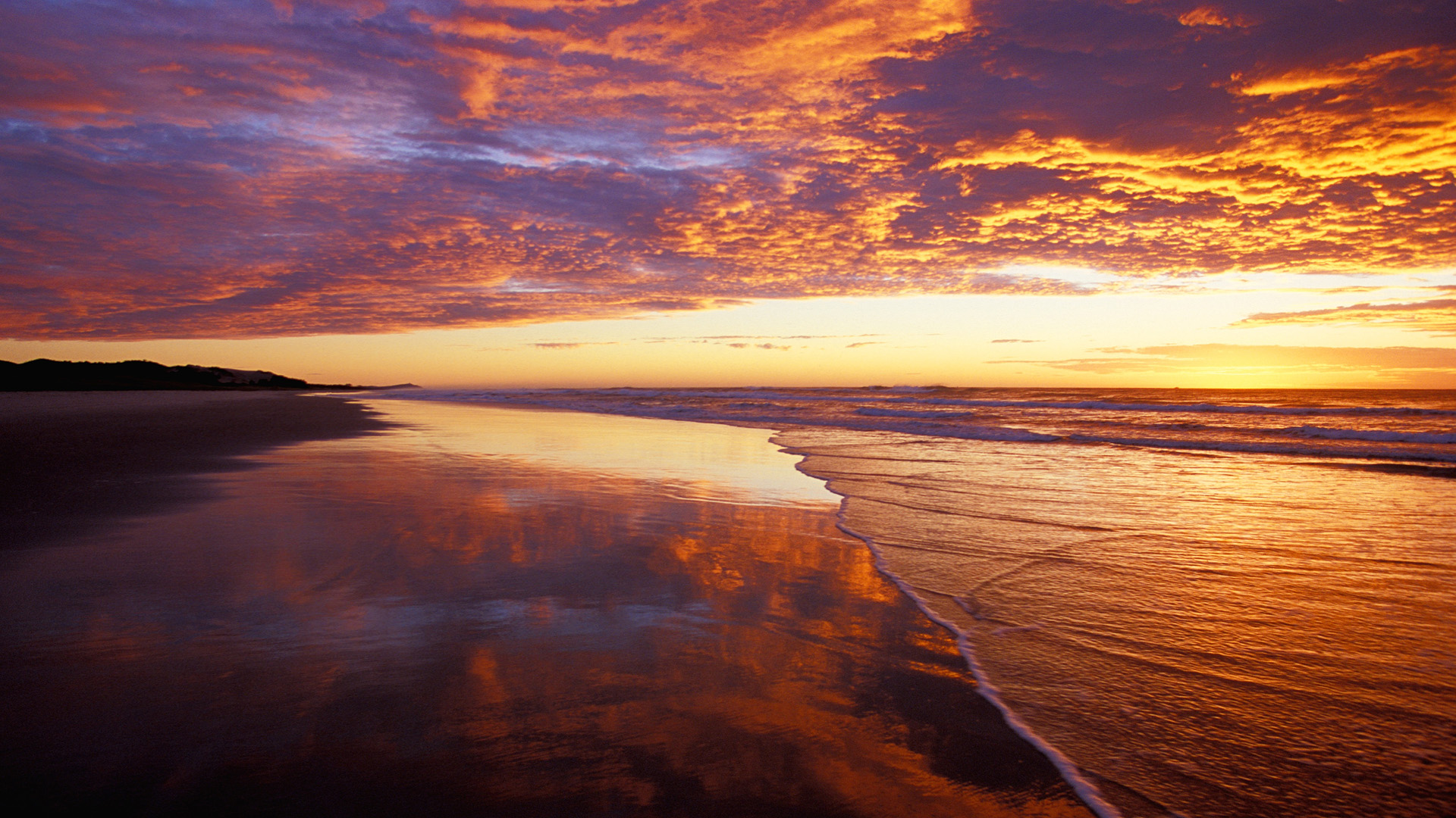 Beach at Sunrise with Colorful Clouds and Ocean Reflection HD Wallpaper