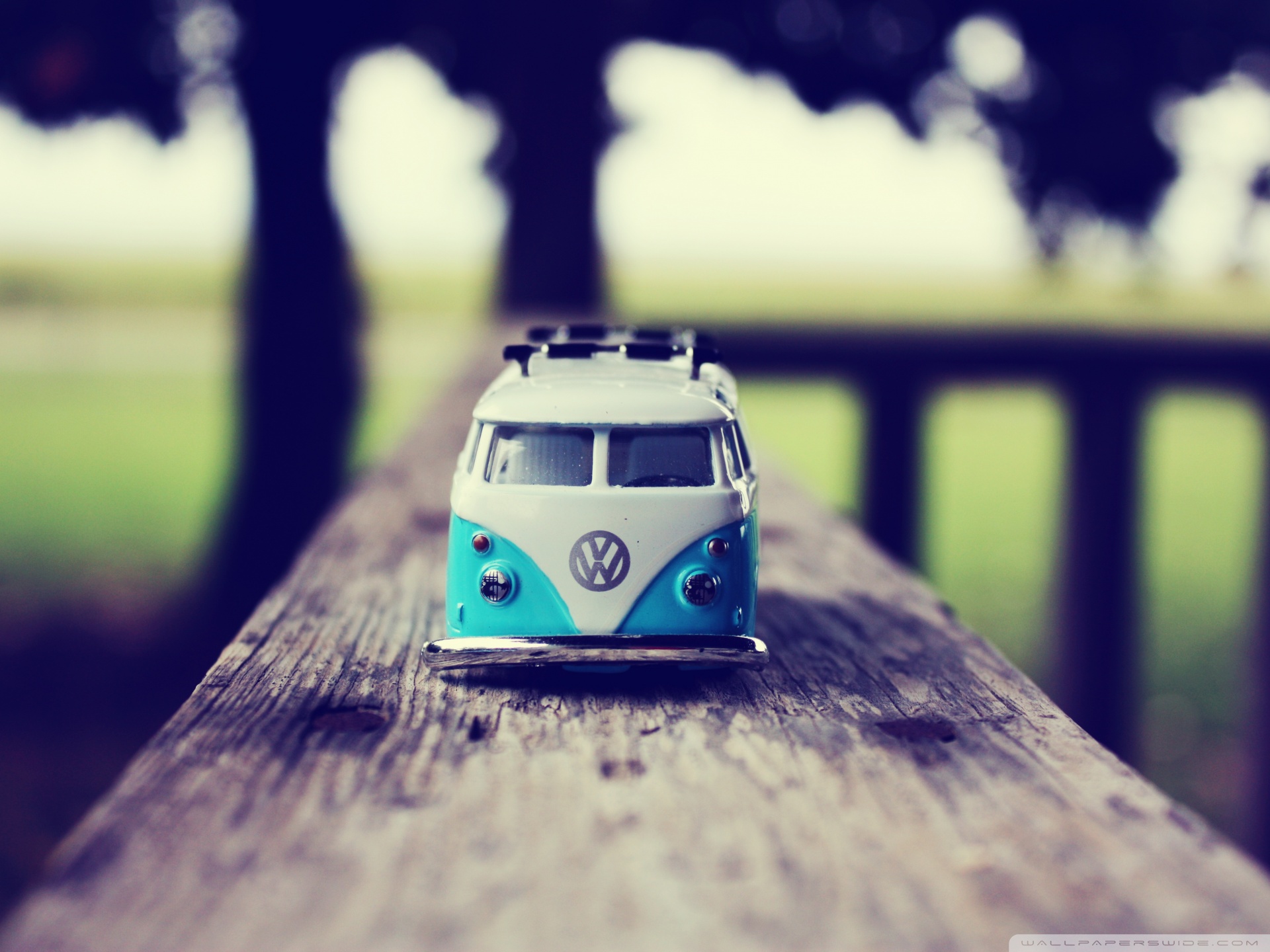 Toy Volkswagen Bus on a wooden surface HD Wallpaper