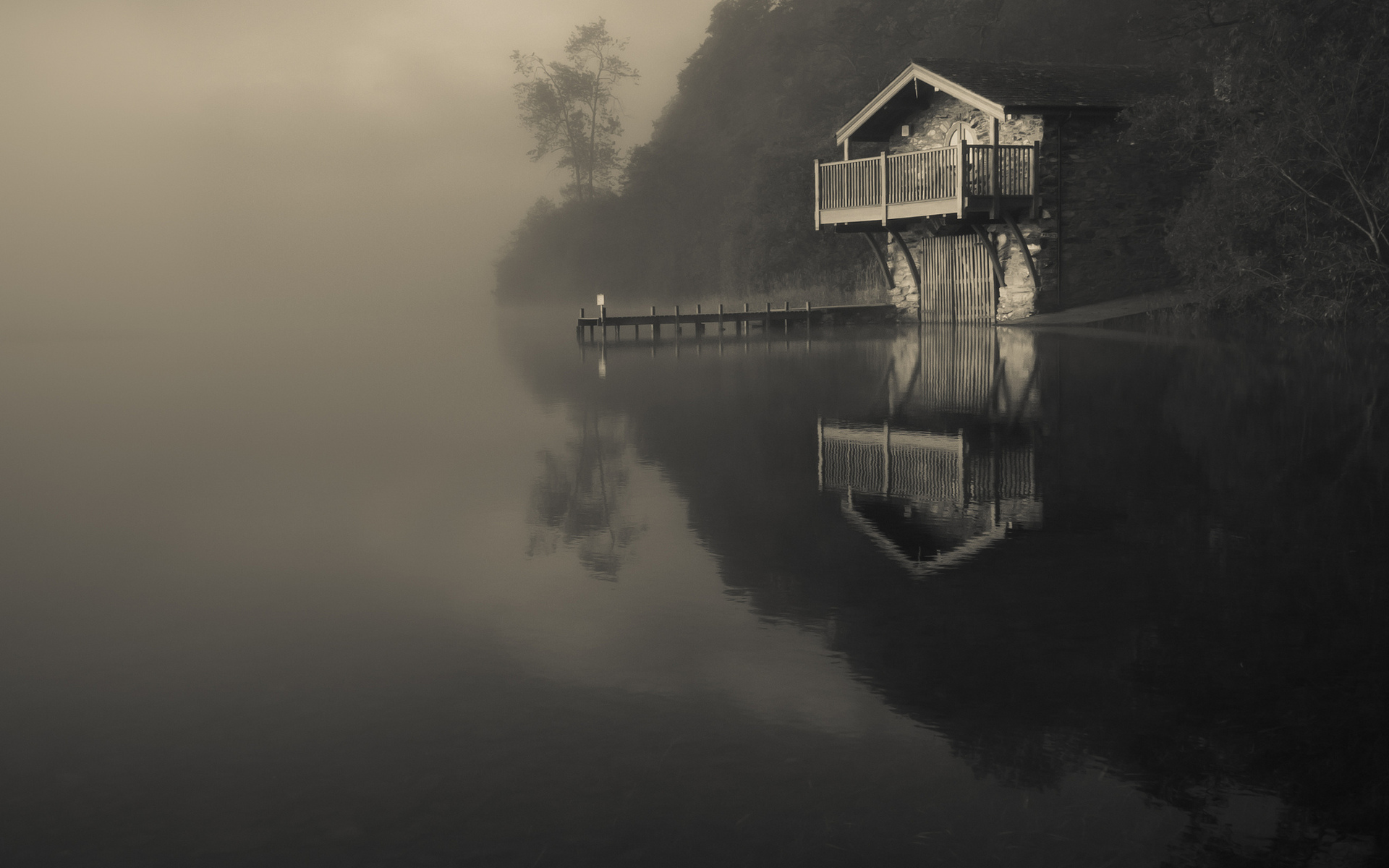 Boathouse on a foggy lake with reflections HD Wallpaper