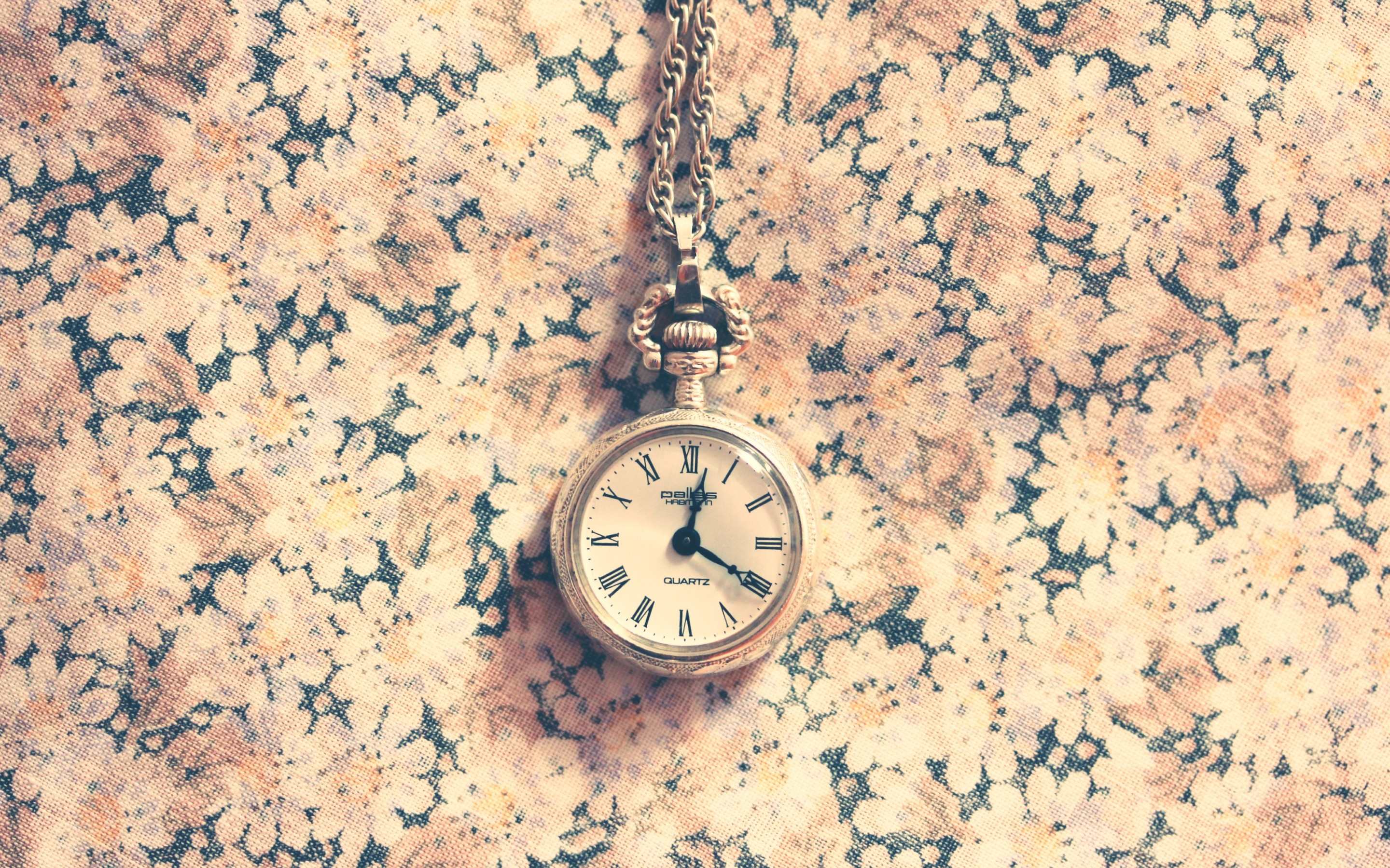 Pocket watch on floral fabric HD Wallpaper