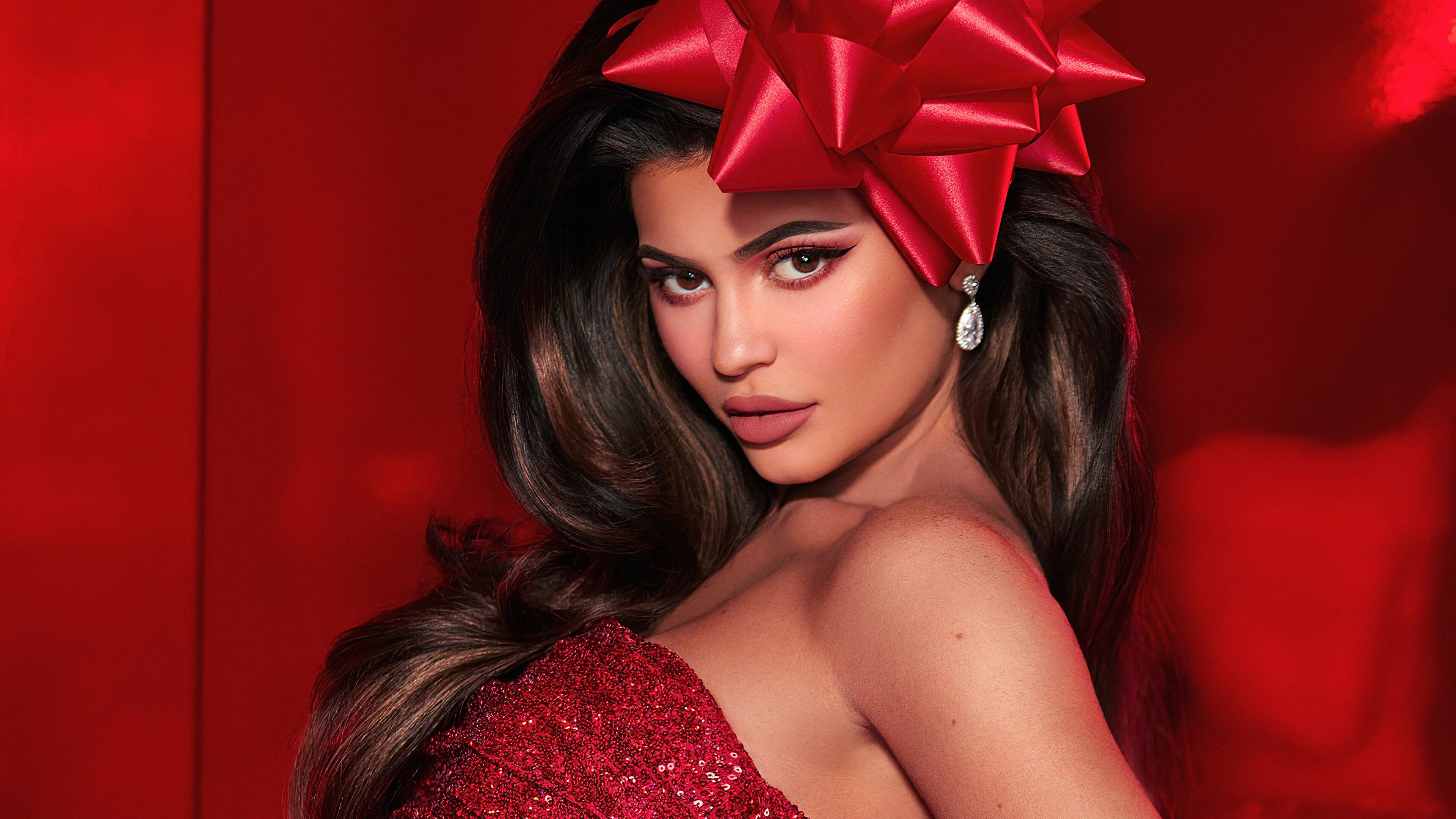 Kylie Jenner with Red Bow and Earrings 4K HD Wallpaper