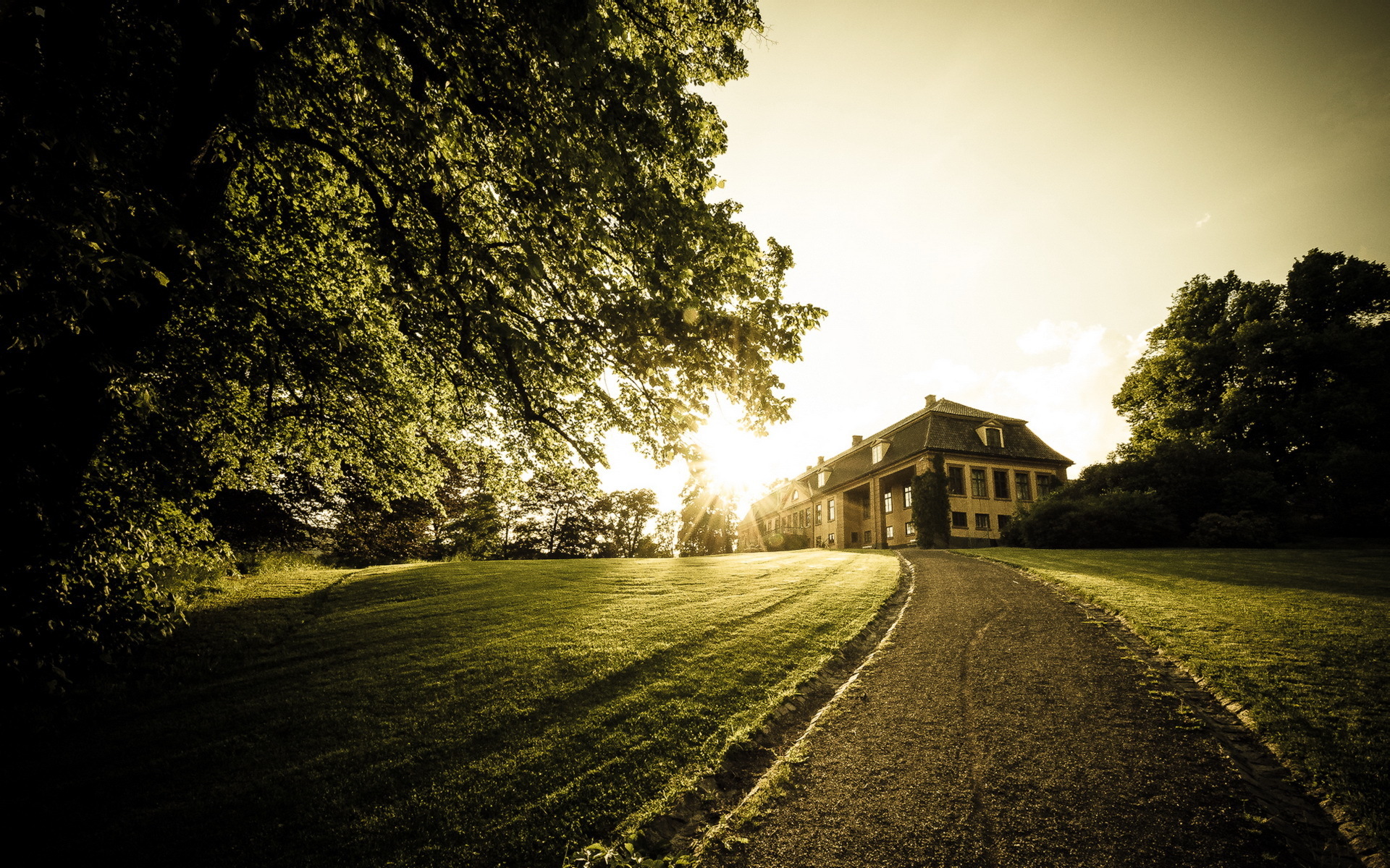 Mansion on a hill with a pathway HD Wallpaper