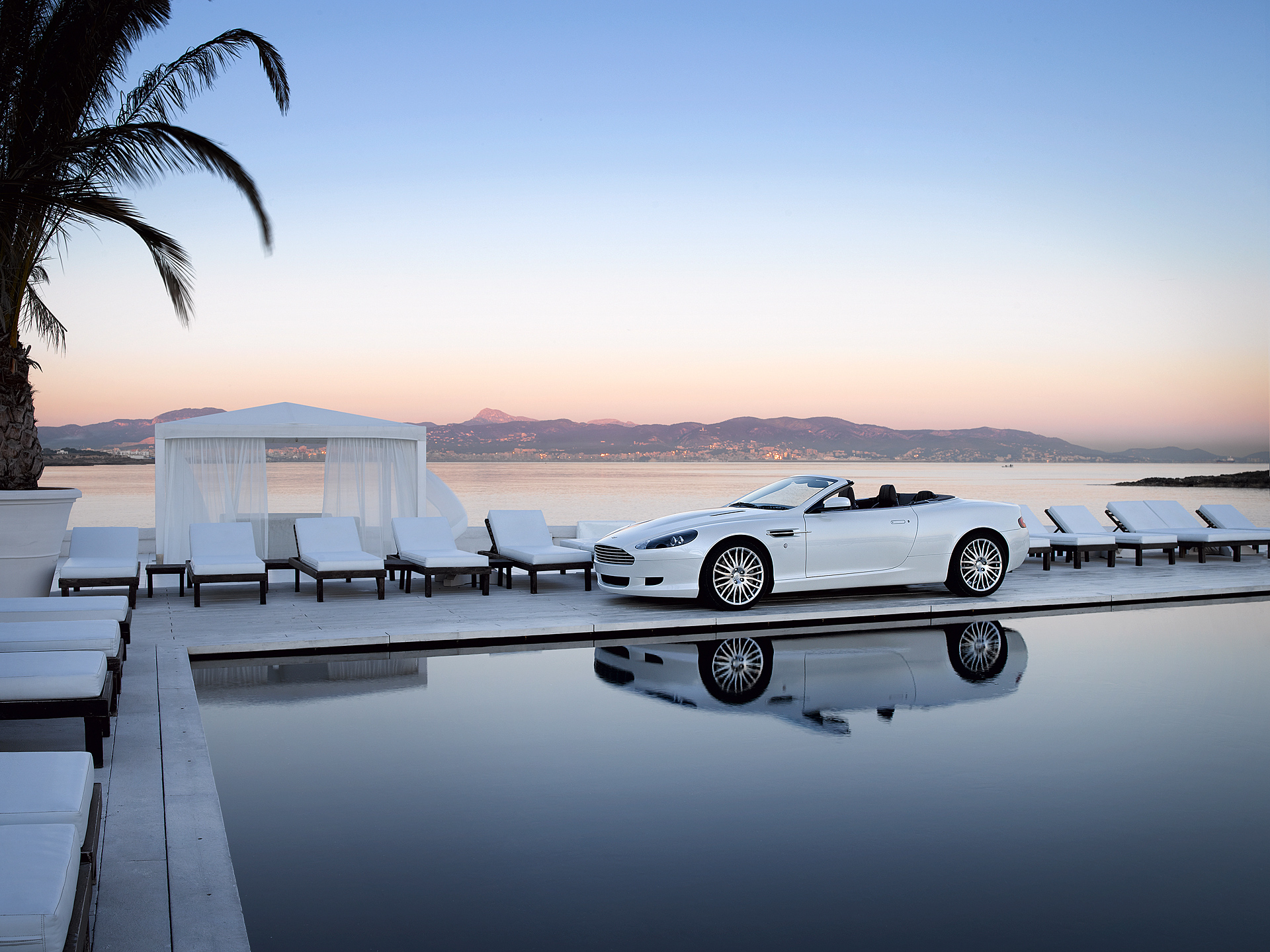 White Aston Martin Convertible by the Pool at Sunset HD Wallpaper