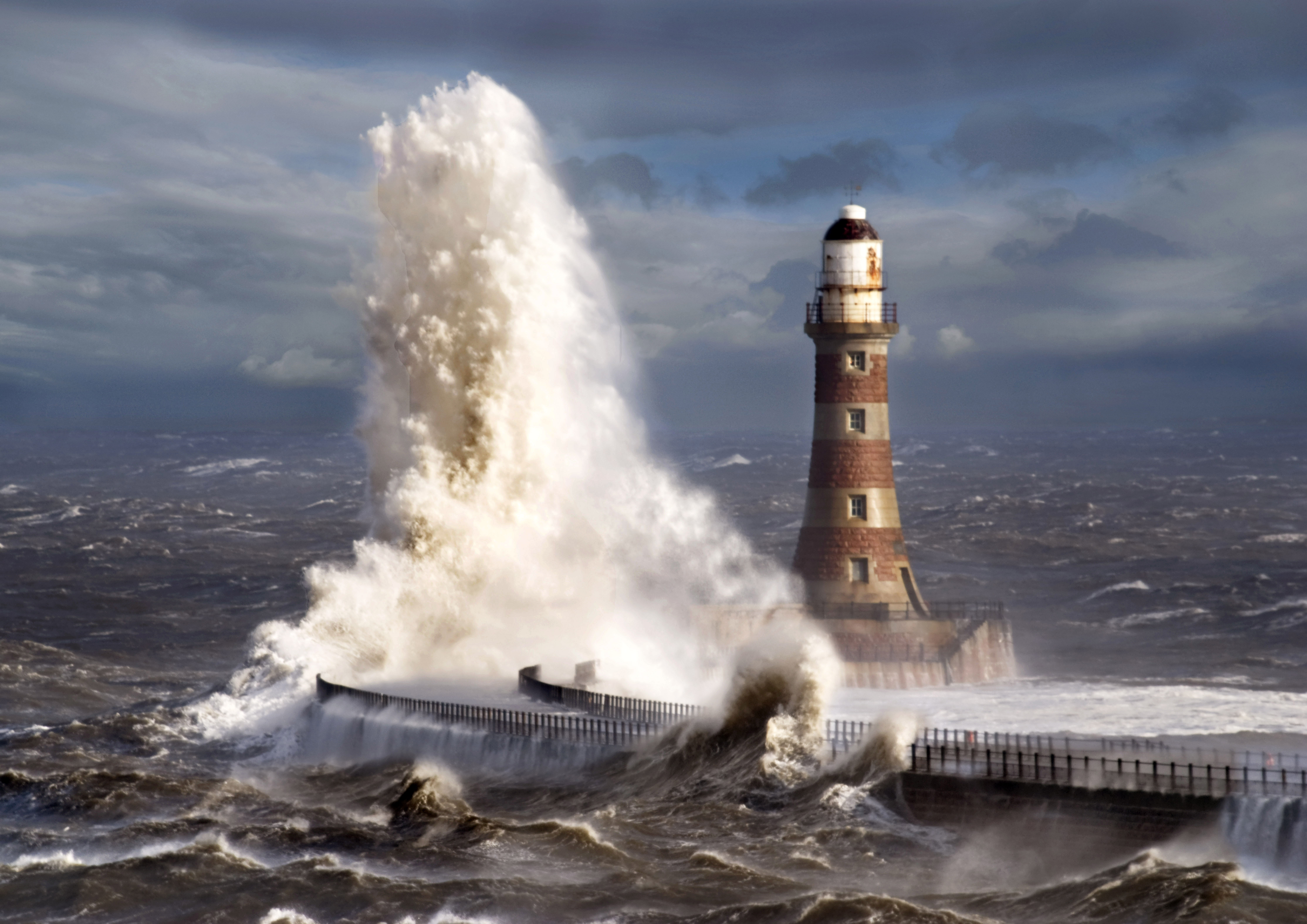 Stormy Seas Crash Against a Lighthouse HD Wallpaper