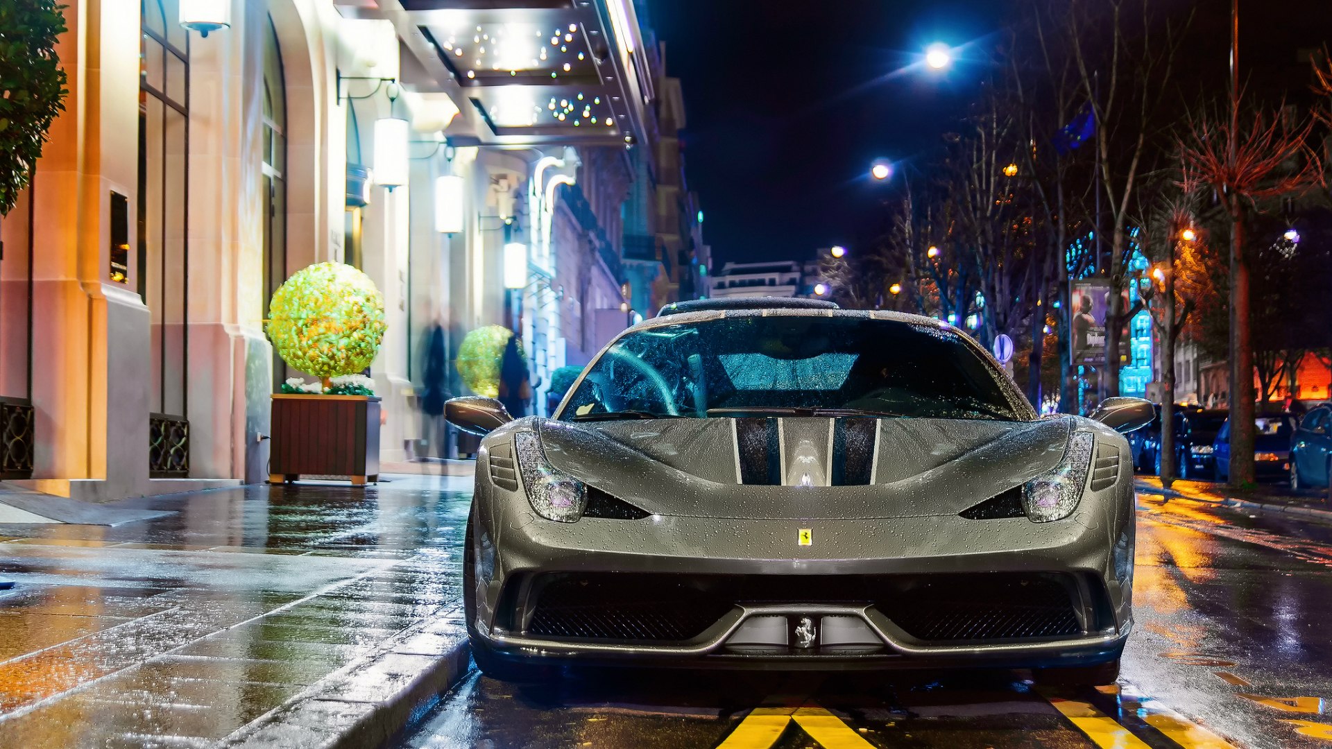 Ferrari parked on a wet street at night HD Wallpaper