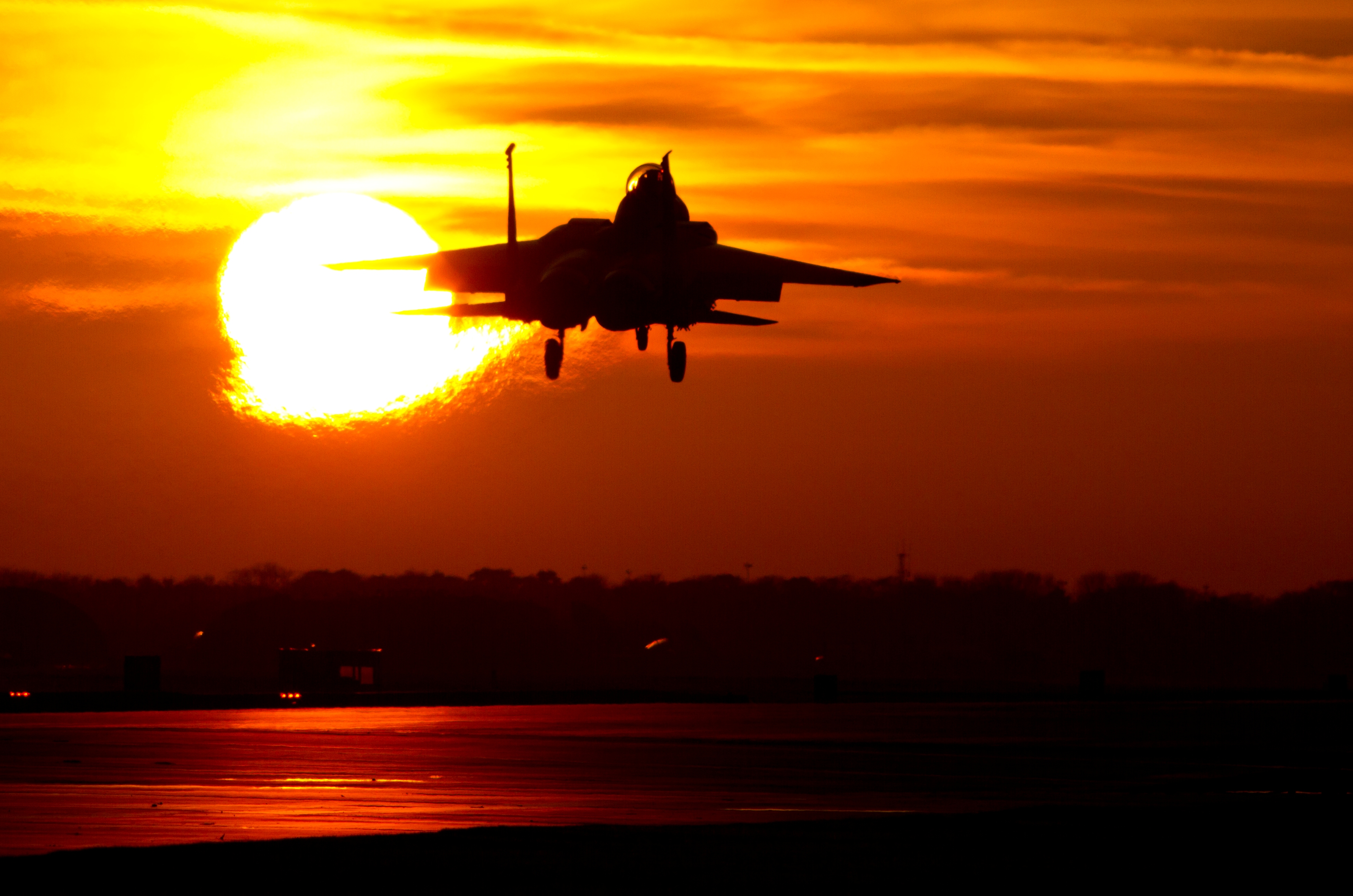 McDonnell Douglas F-15E Strike Eagle taking off at sunset HD Wallpaper
