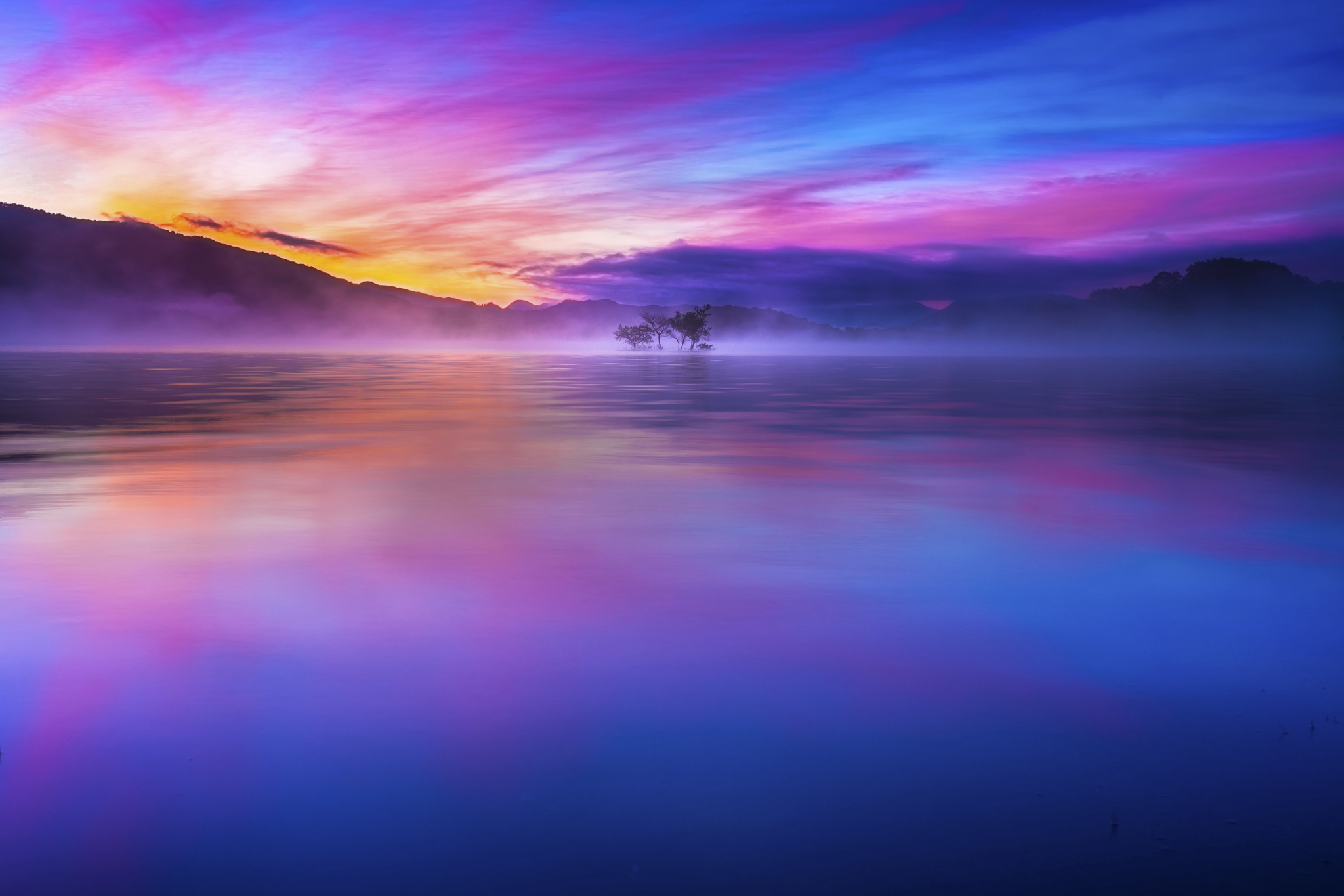 Misty lake with colorful sunrise and mountain reflection HD Wallpaper