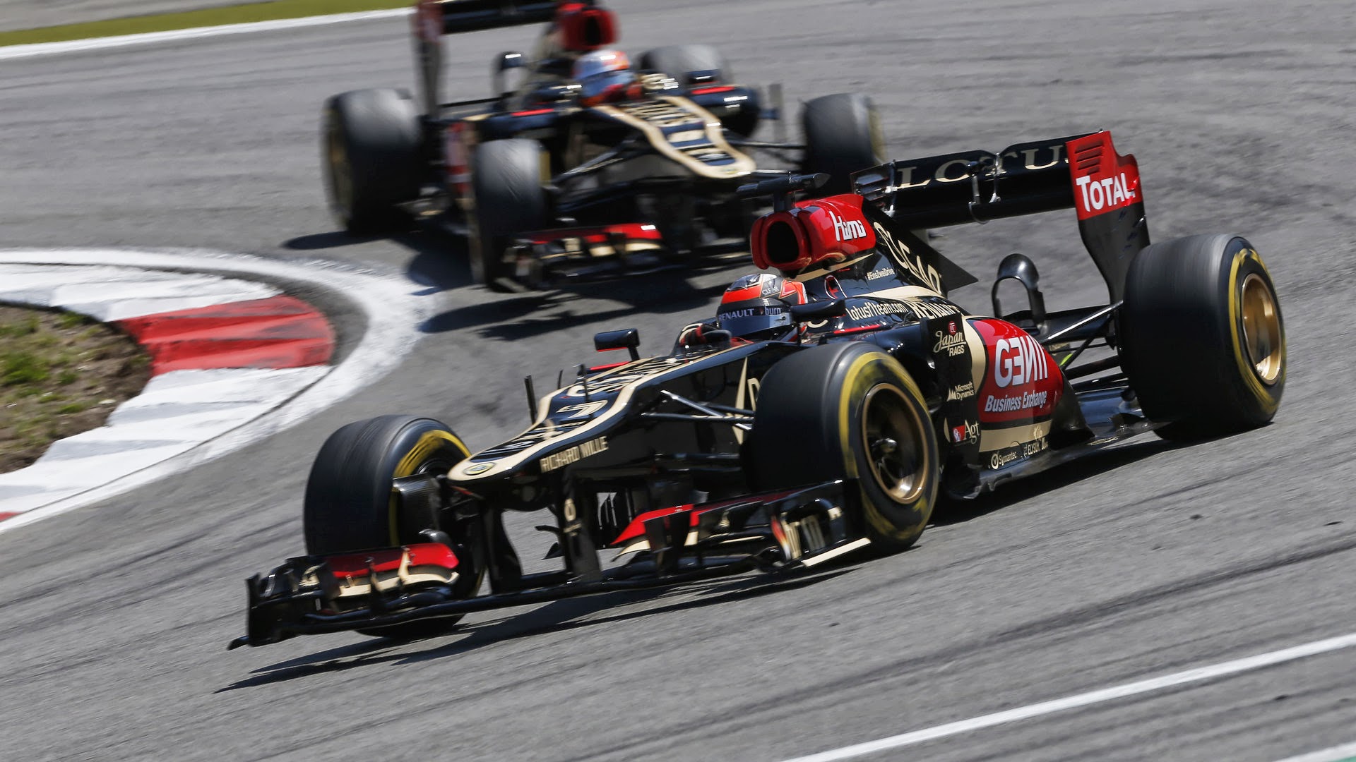 Formula 1 race cars on a track HD Wallpaper