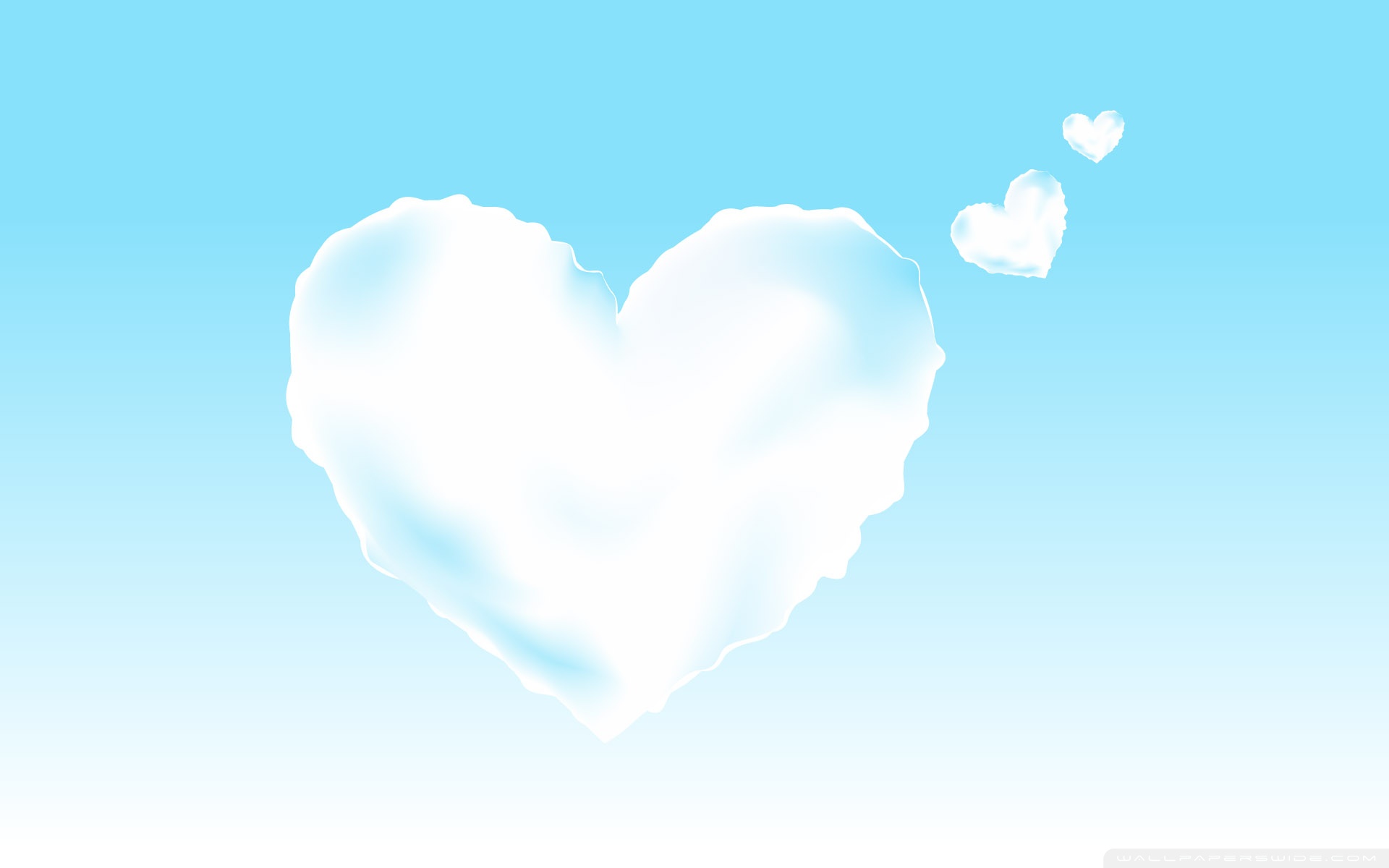 Heart-shaped clouds in a blue sky HD Wallpaper