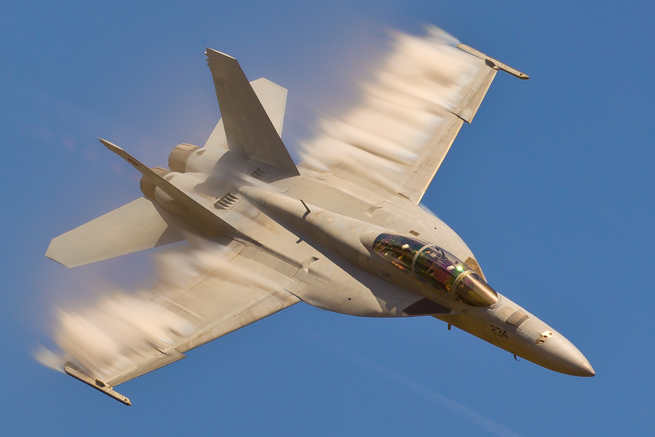 F/A-18 Super Hornet in flight with vapor trails HD Wallpaper