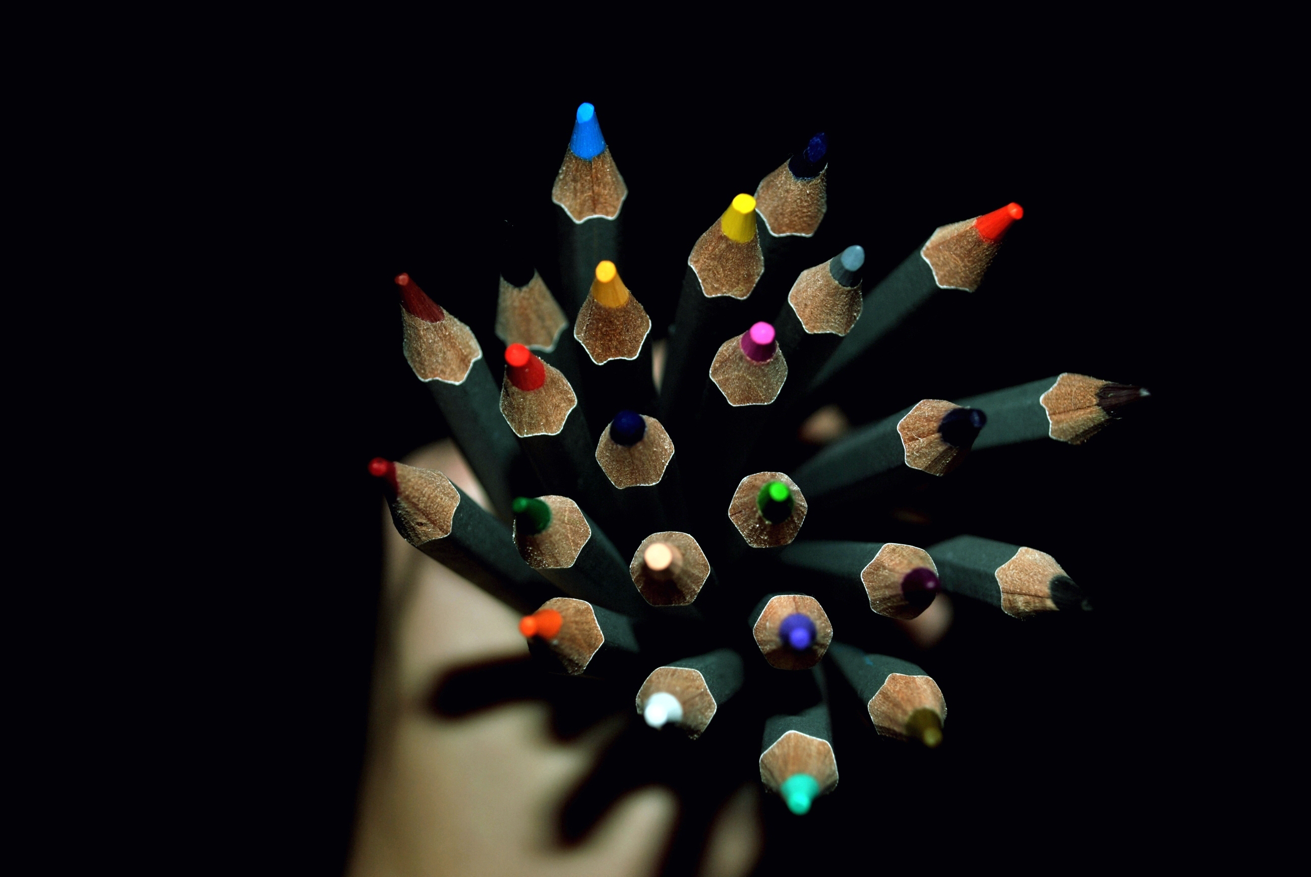 Top view of colored pencils on black background HD Wallpaper