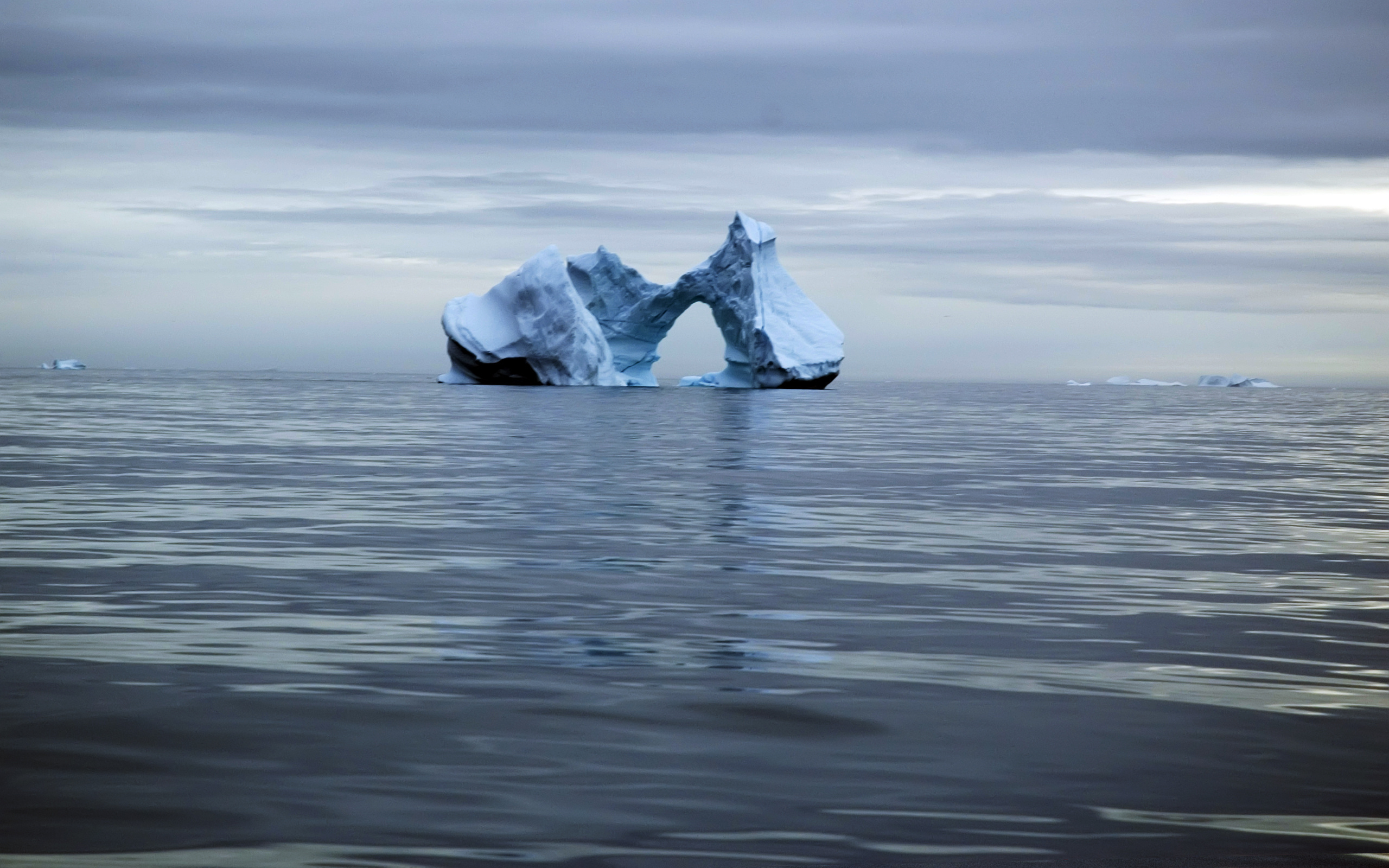 Iceberg with arch in the ocean HD Wallpaper