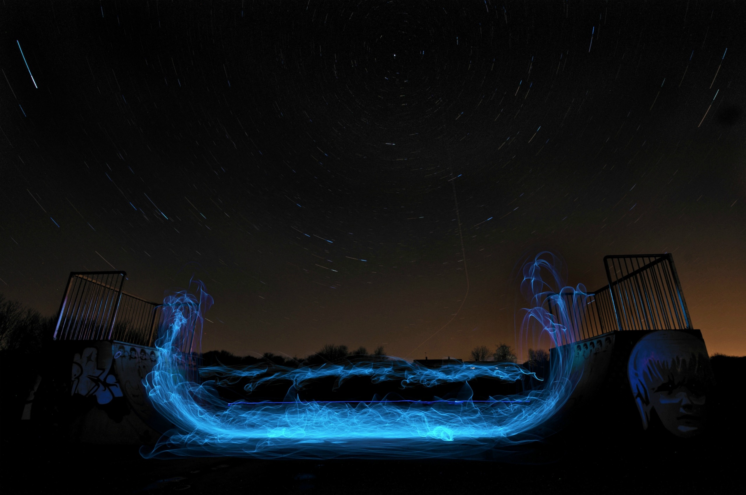 Light painting in skatepark at night with star trails HD Wallpaper
