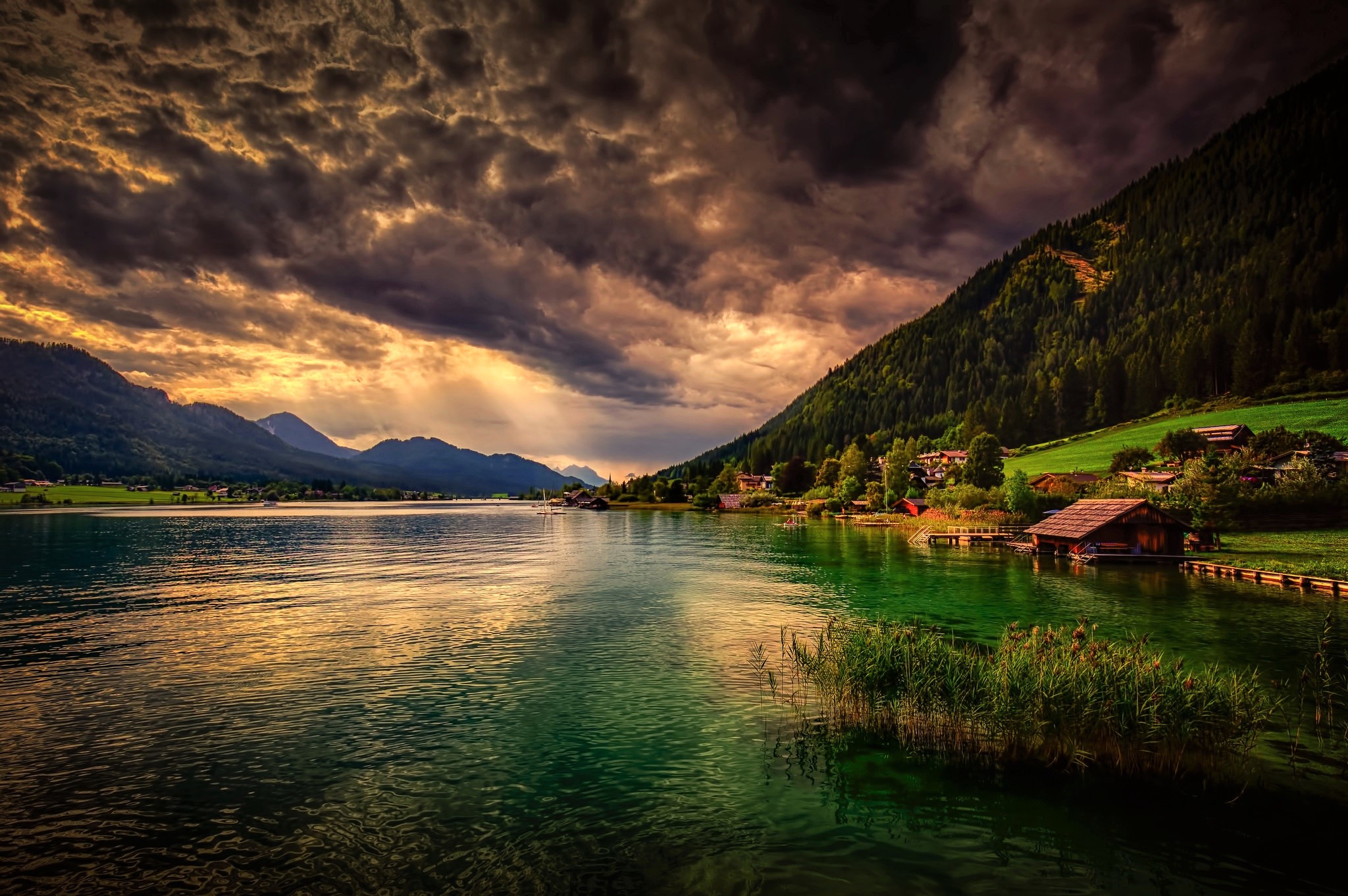Lake village with mountains and stormy clouds HD Wallpaper